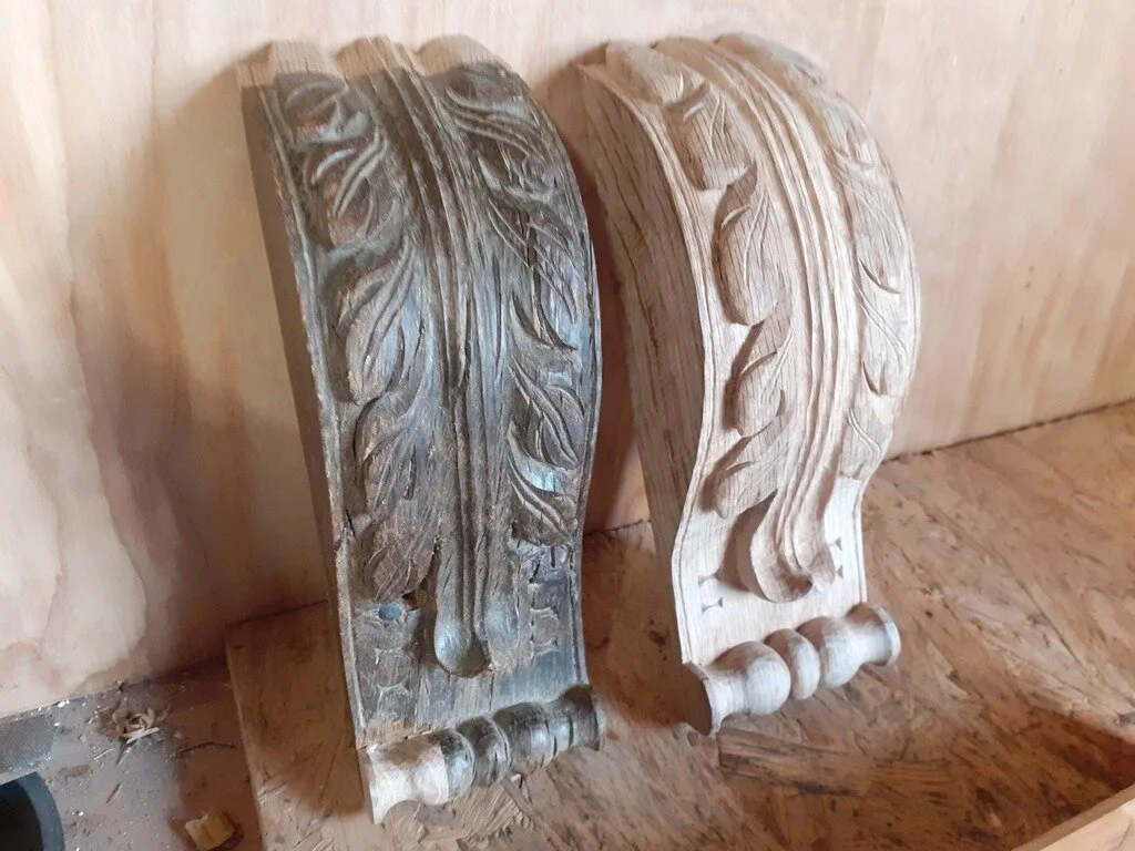 Corbel on the left has been repaired, while the corbel on the right was copied to match. The carving is part of a Cotswold country house restoration project