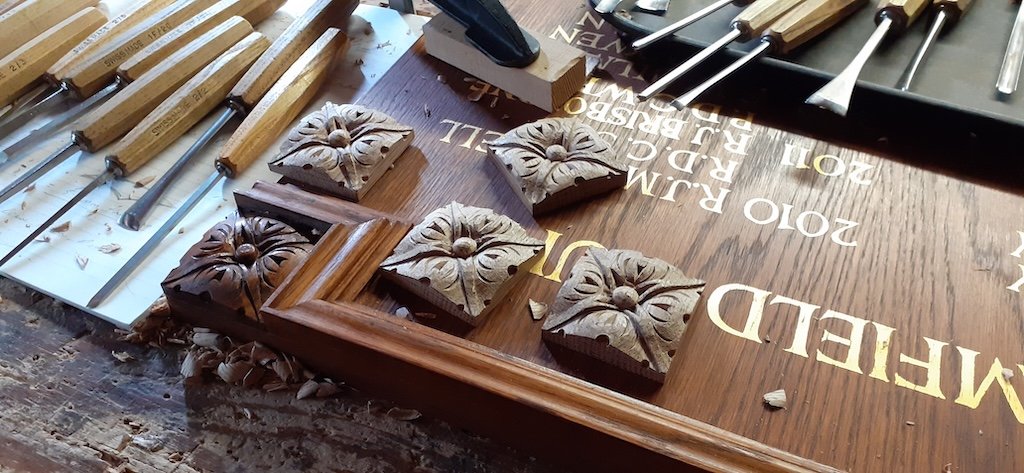 Four extra patrae carved for an extended golf club board