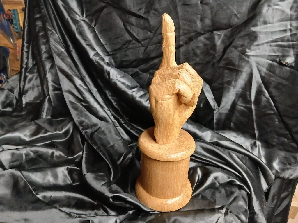 An Umpire's Trophy carved in oak for the Gloucestershire Association of Cricket Officials