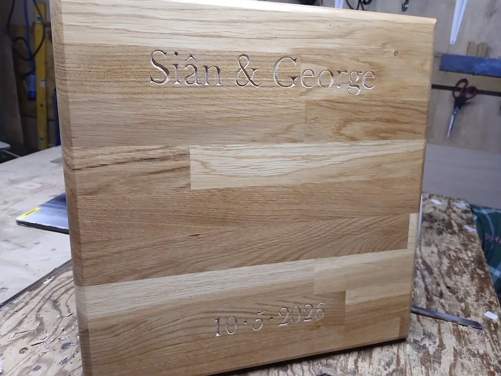 Incised lettering carved into a client's bread board as a wedding gift