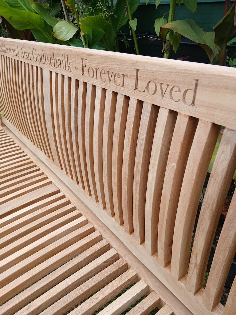 Dedication carved into a client's bench