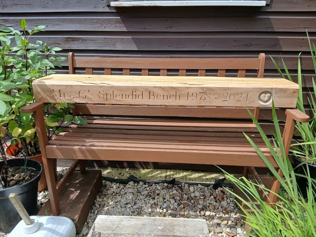 Lettering carved for custom made bench incorporating a heart