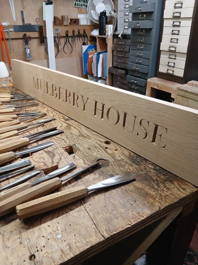 50mm incised lettering carved into oak to be incorporated into a cooker hood