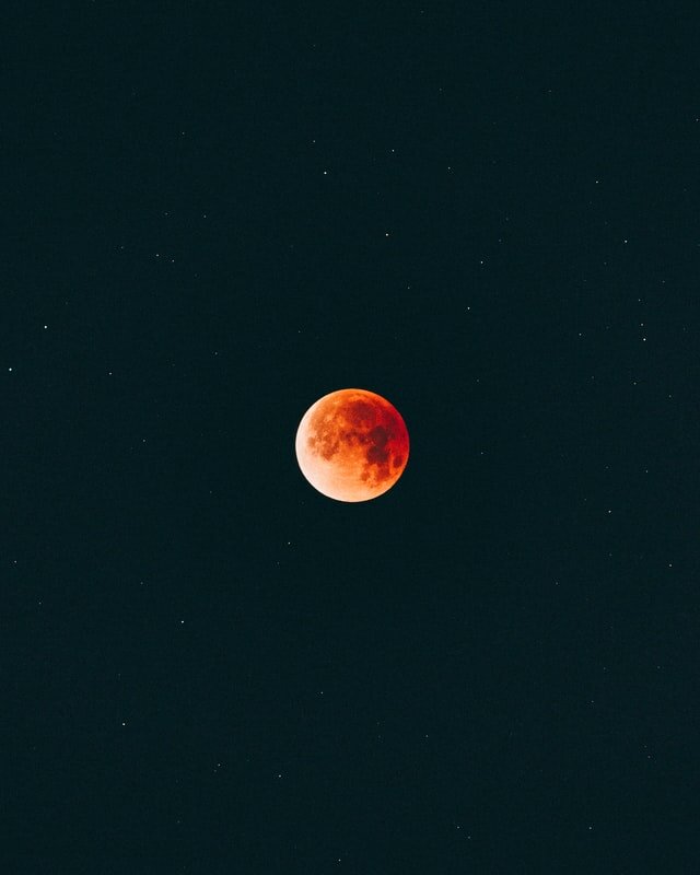 Stunning red moon in dark sky