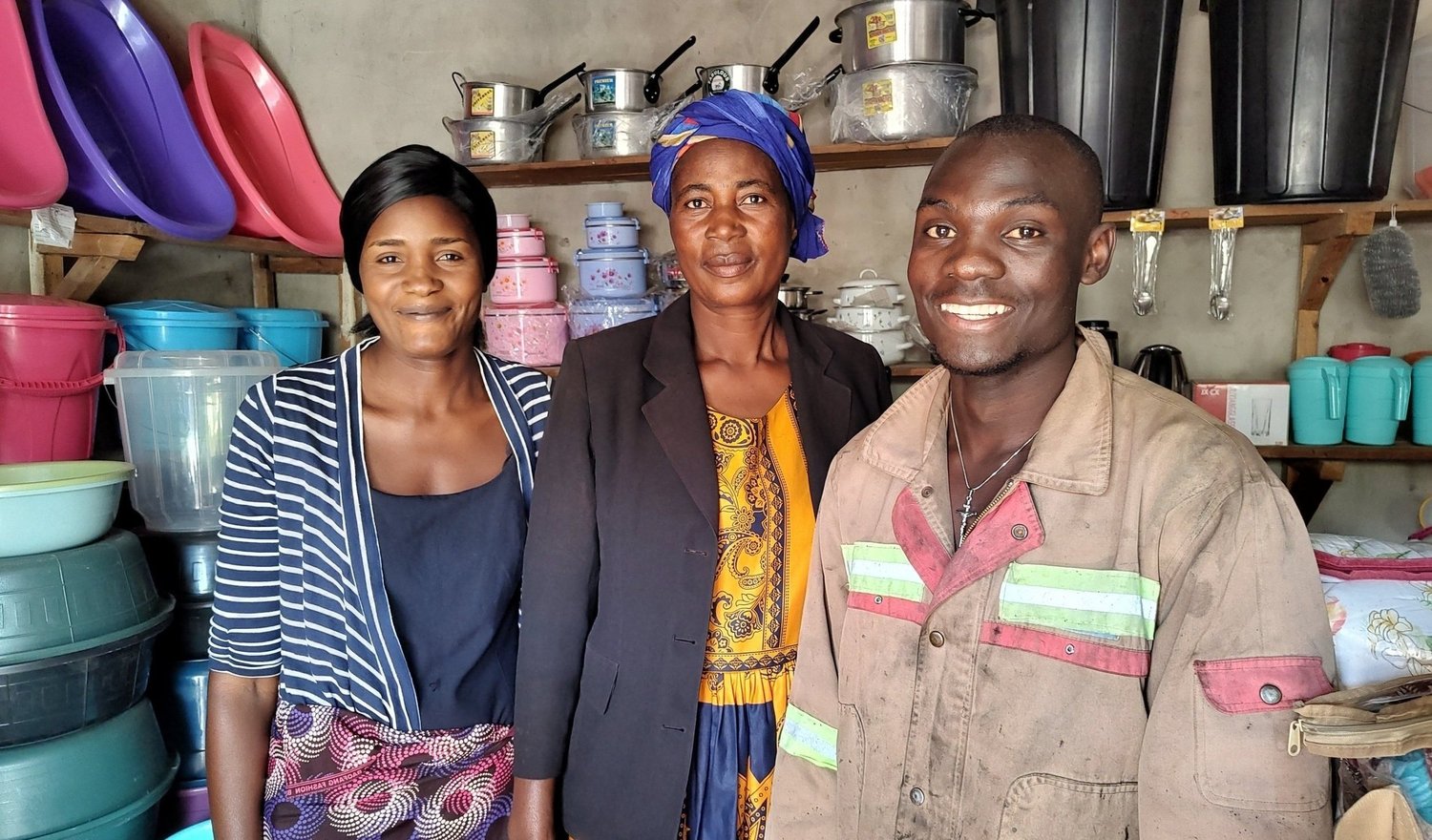 Sharon, Elizabeth and Rivado with stock for their microloan group’s business.