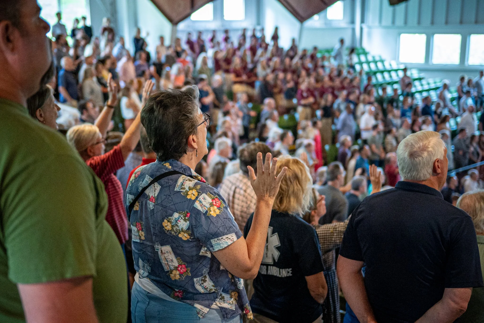Women Worshiping during summer chapel service at CAMP-of-the-WOODS.