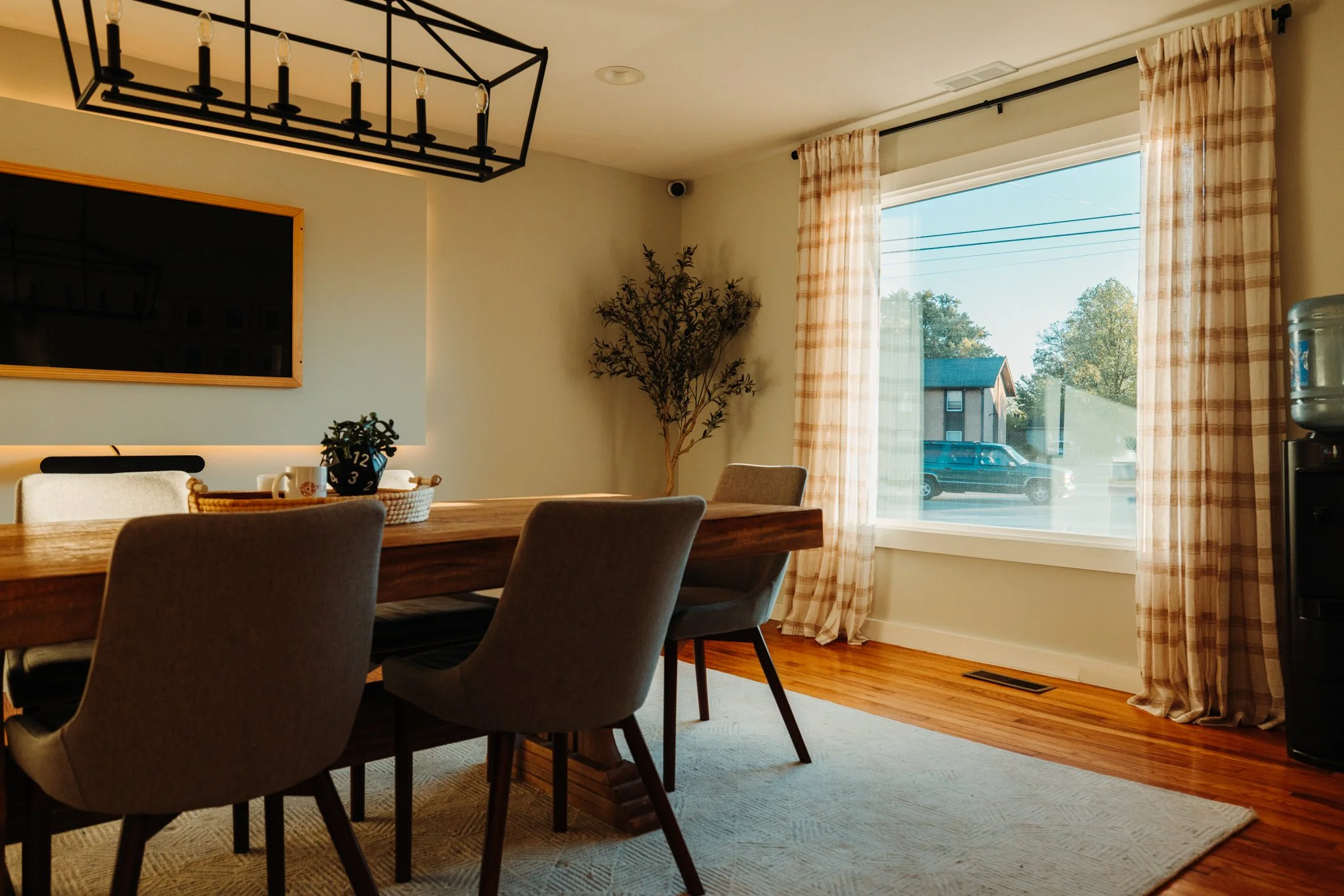 Conference room with plaid curtains and wood dining table