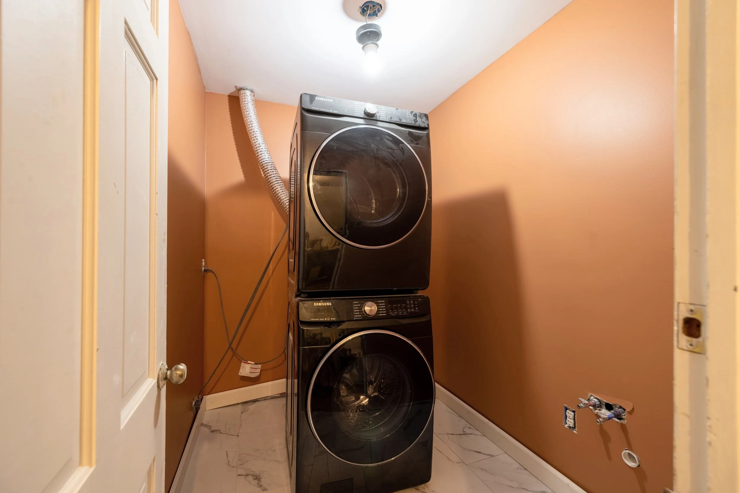Terracotta painted laundry room