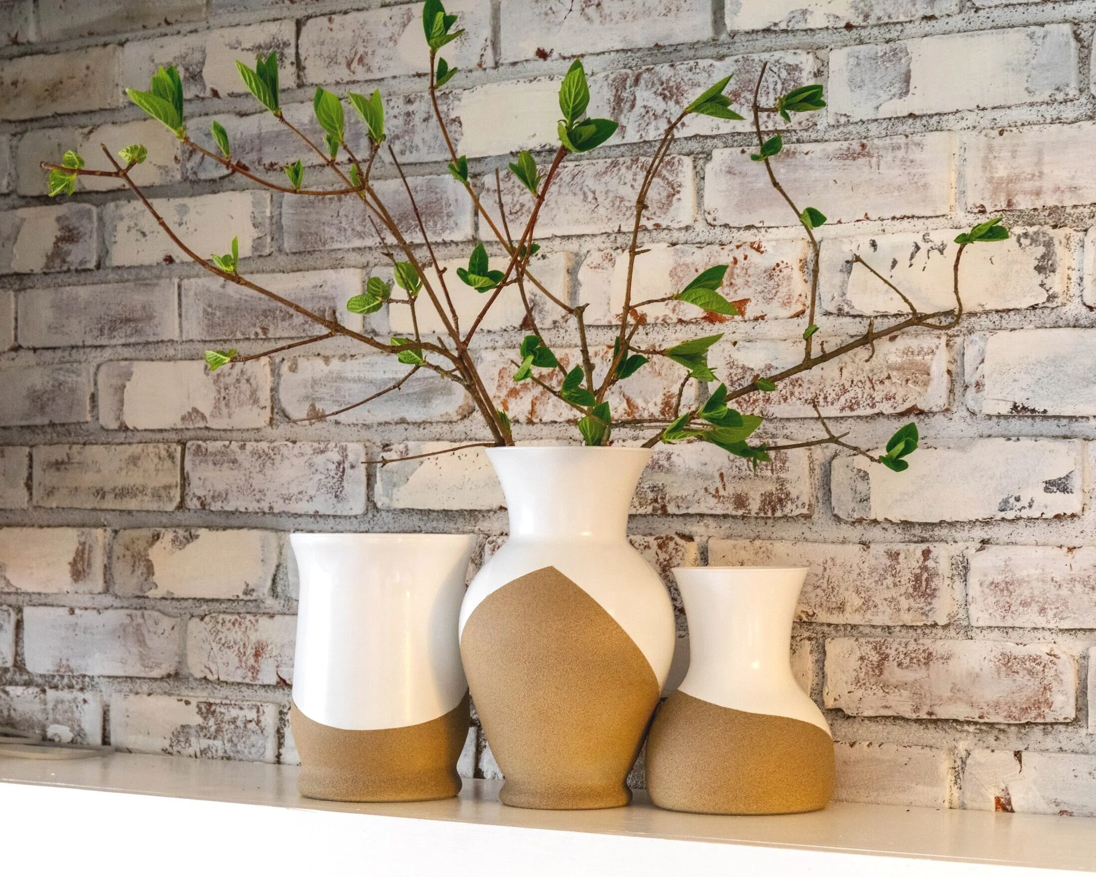 Three_vases_in_front_of_brick_background-min.jpg
