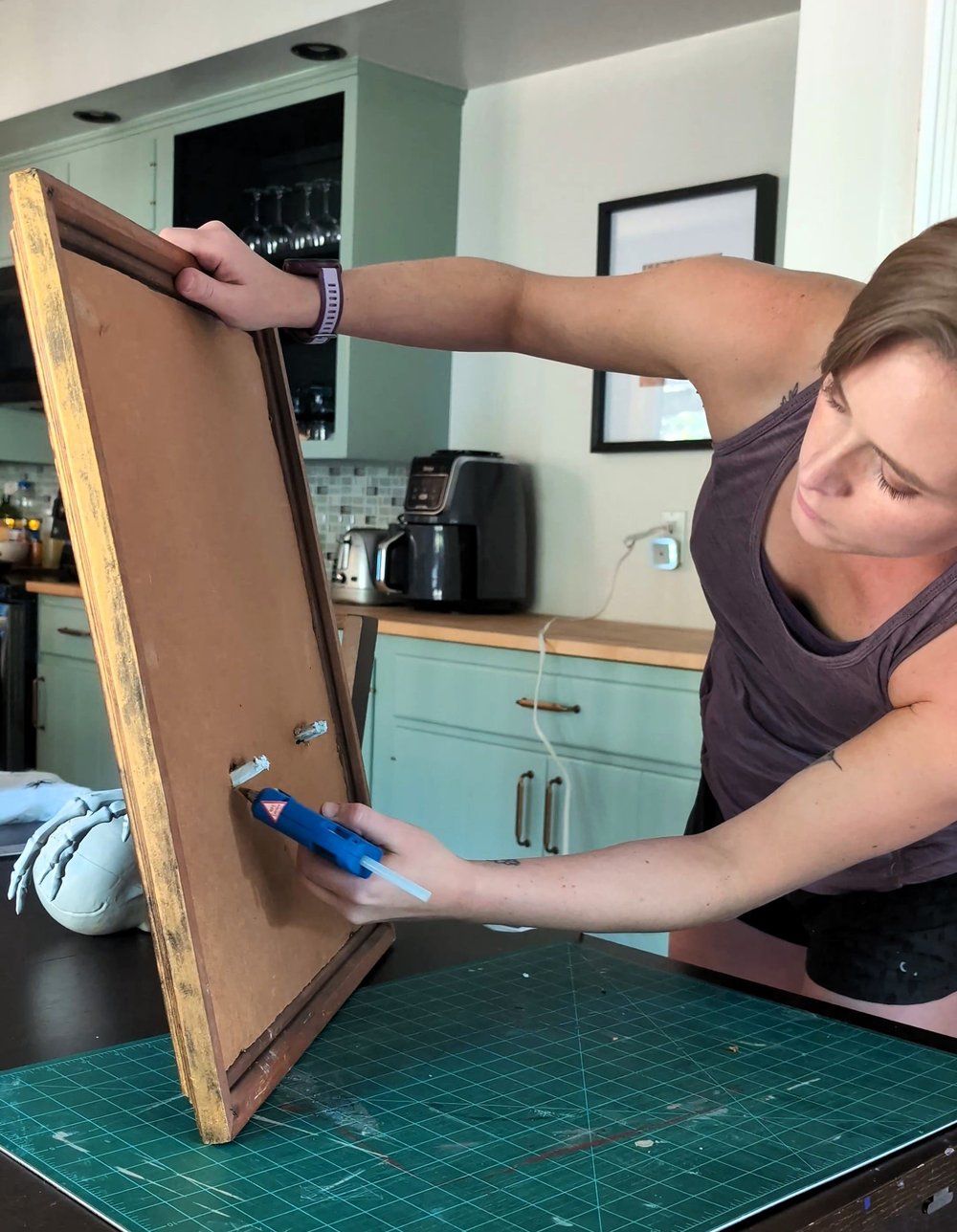 Glueing Skeleton Hands to Frame_2-min.jpg