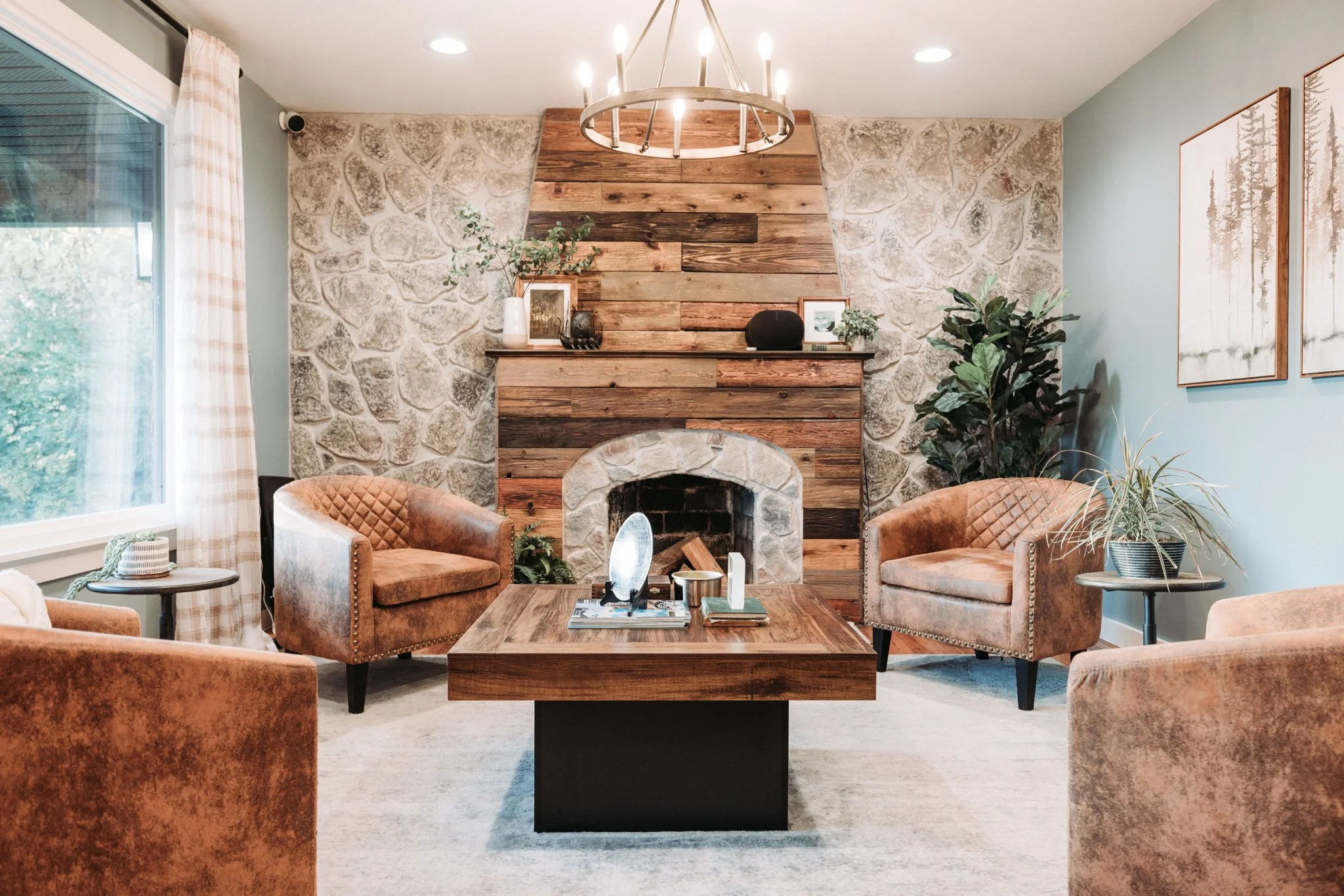 Office lobby with wagon wheel chandelier and stone accent wall