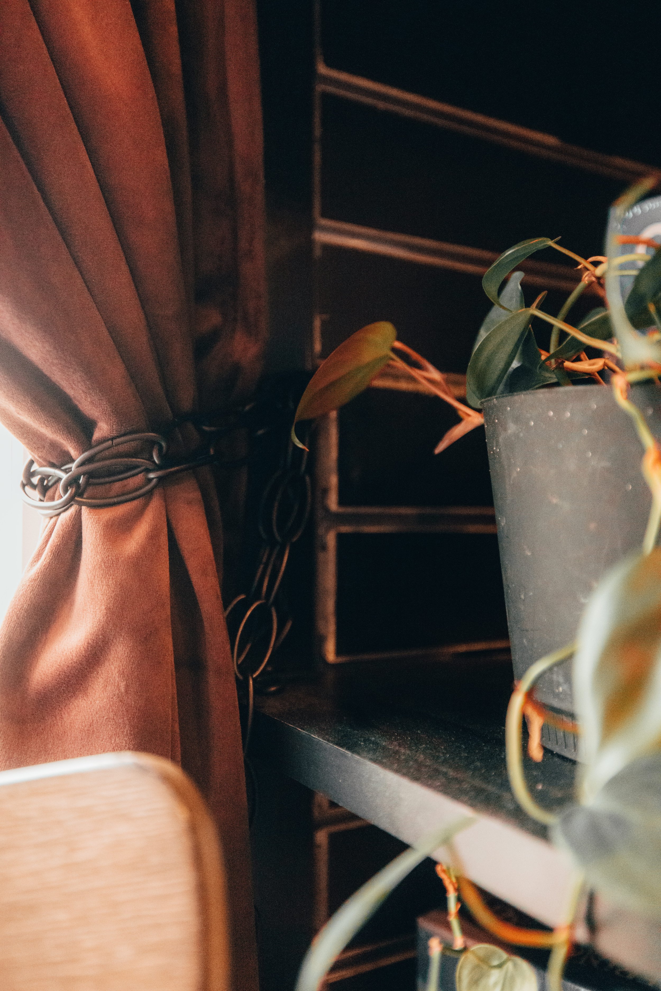 Repurposed chain curtain tie-back detail in Blacksmith's Workshop