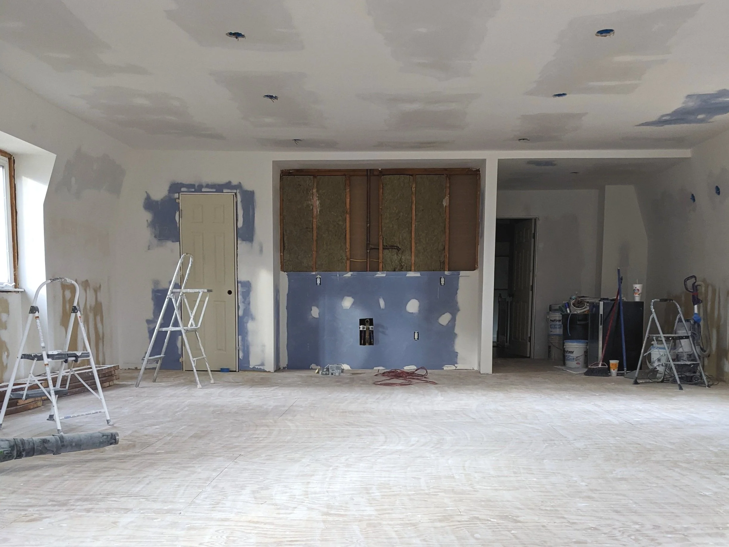 Empty rec room with finished drywall