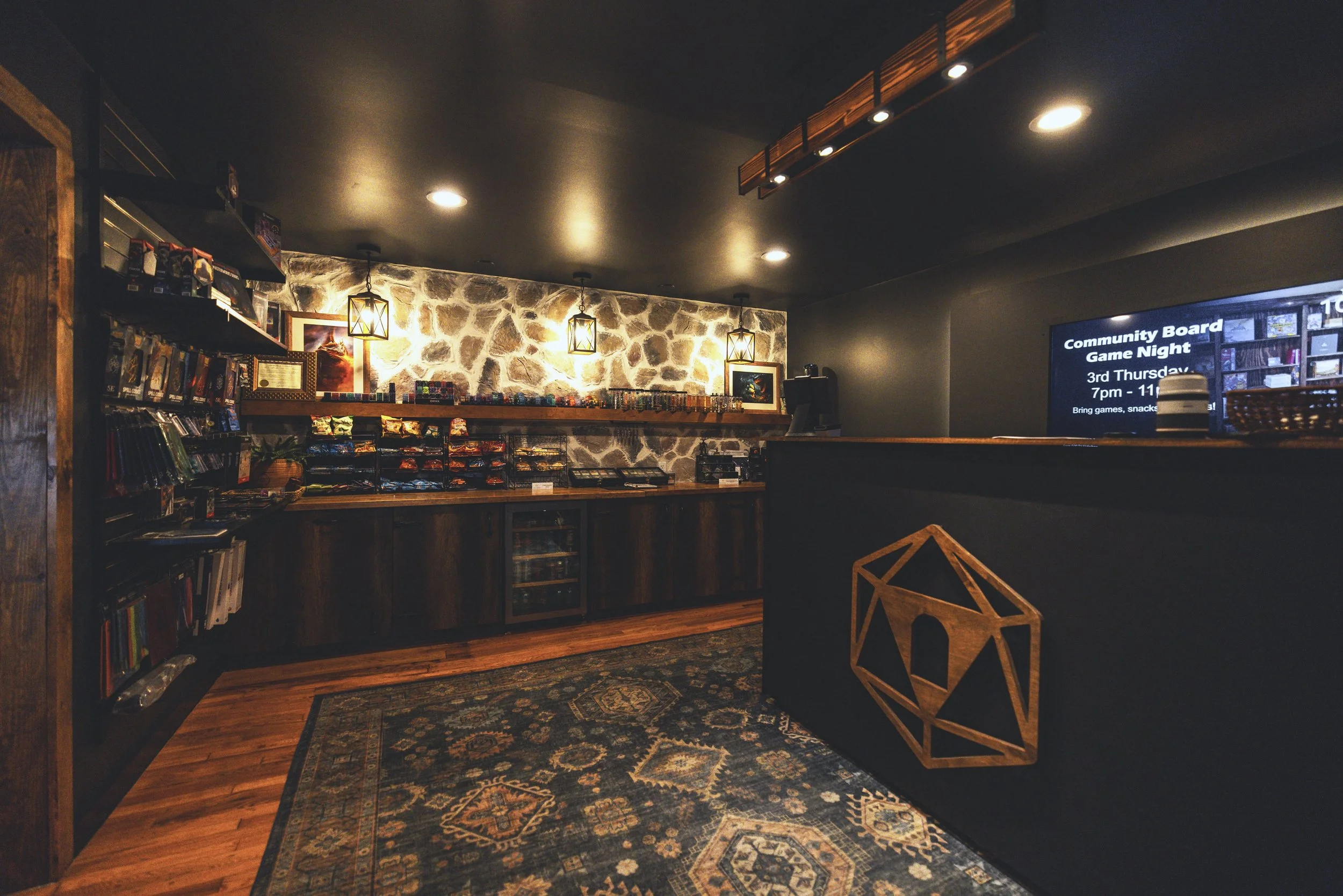 Dark charcoal blacksmith-themed retail counter with stone wall and dice display