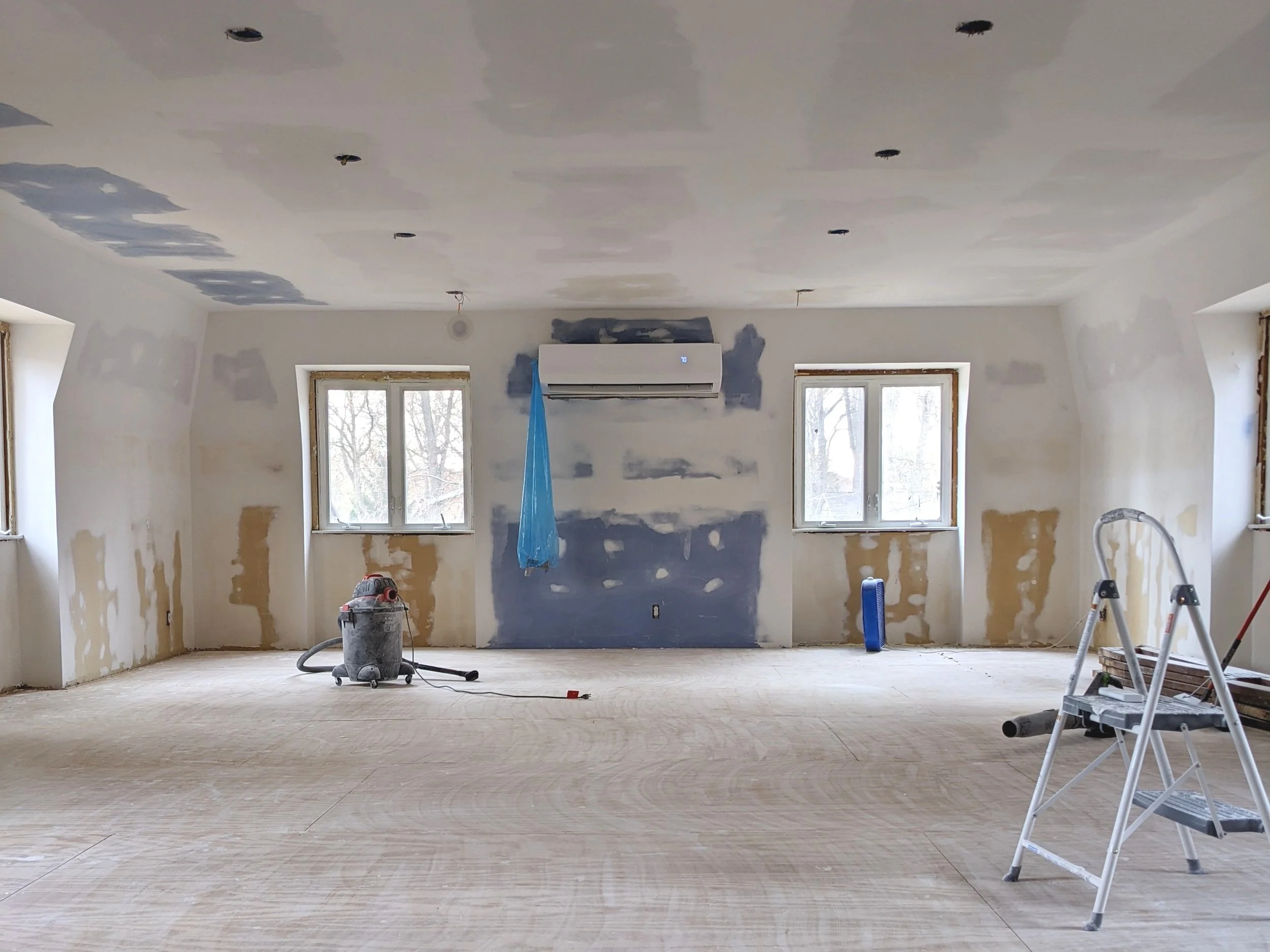Empty rec room with new drywall