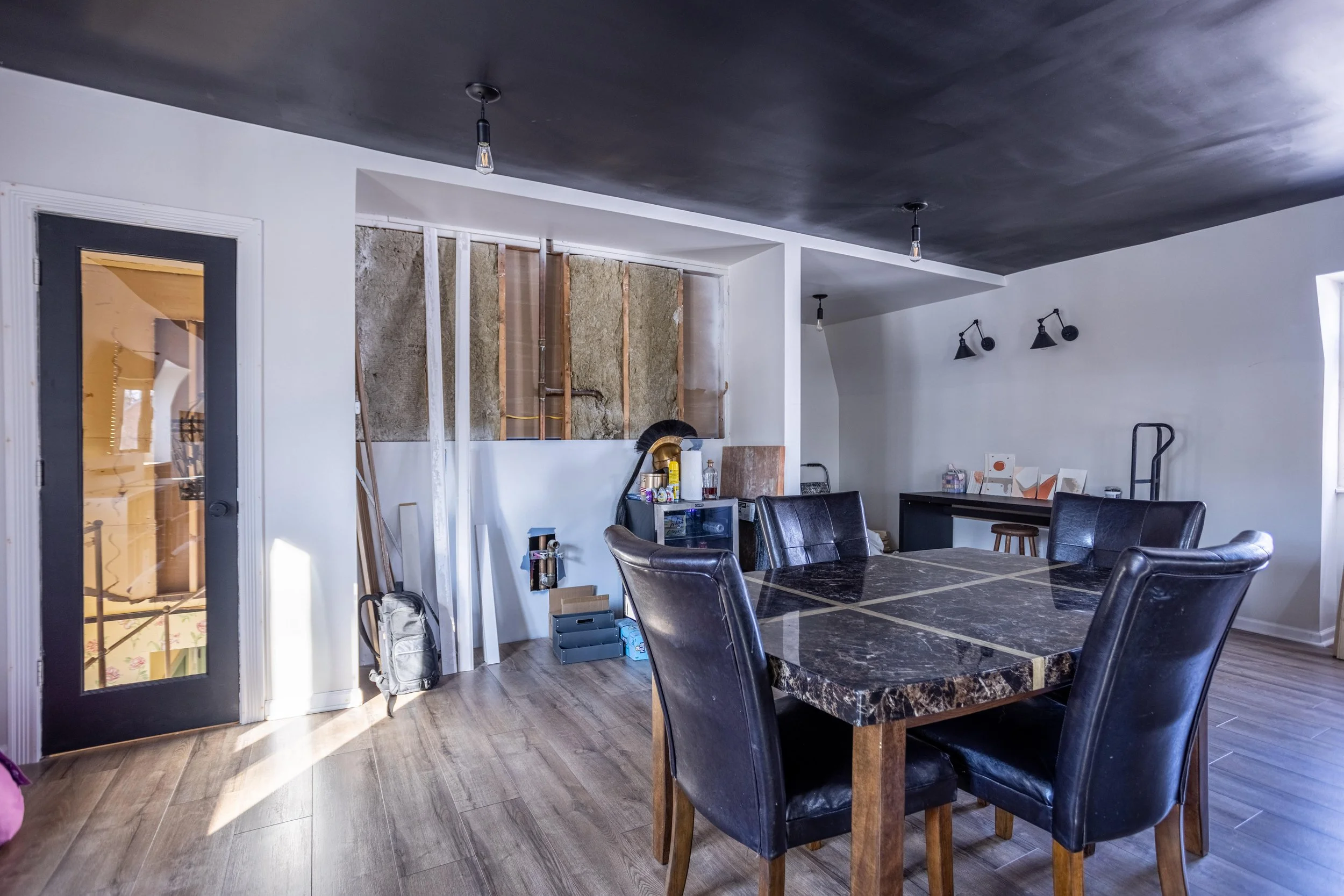Black glass door with table and chairs