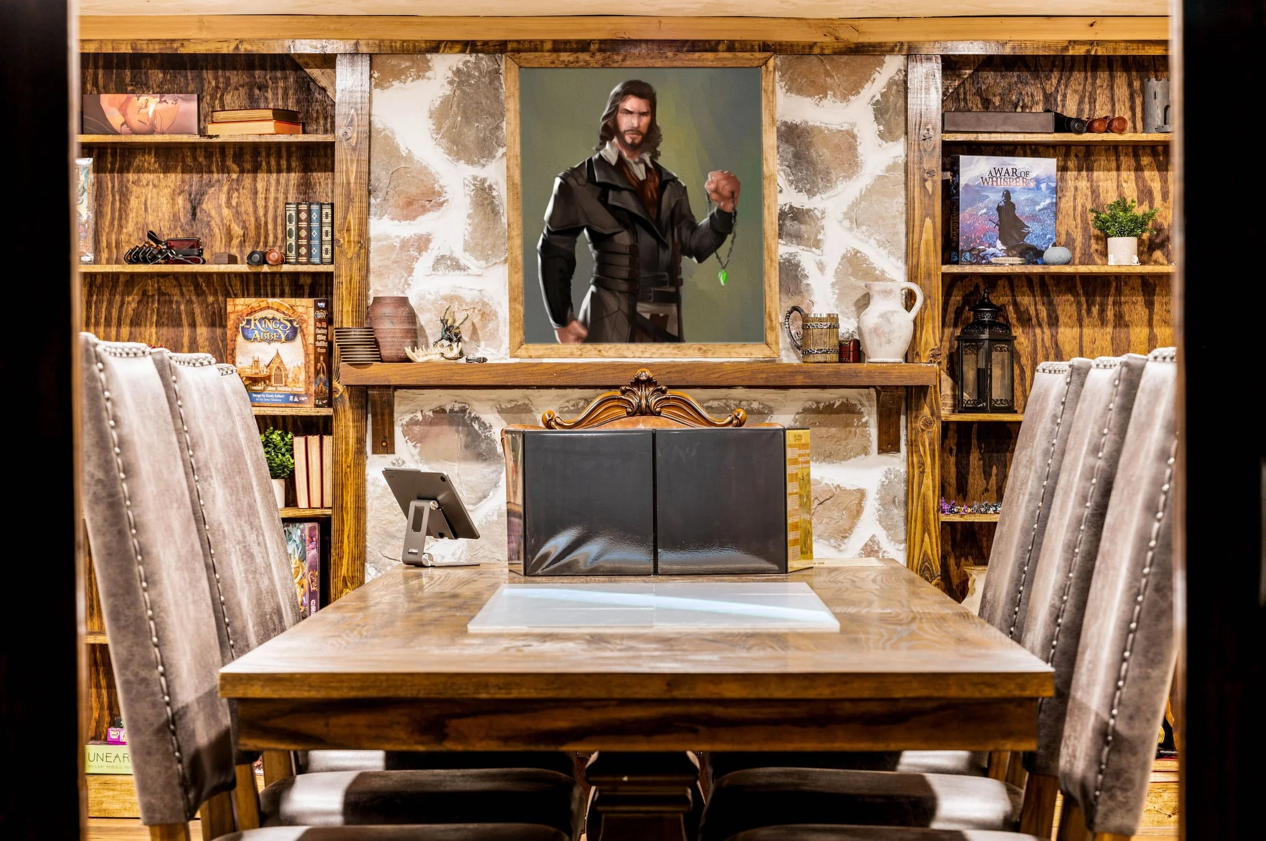 Framed character artwork and board games on built-in shelves
