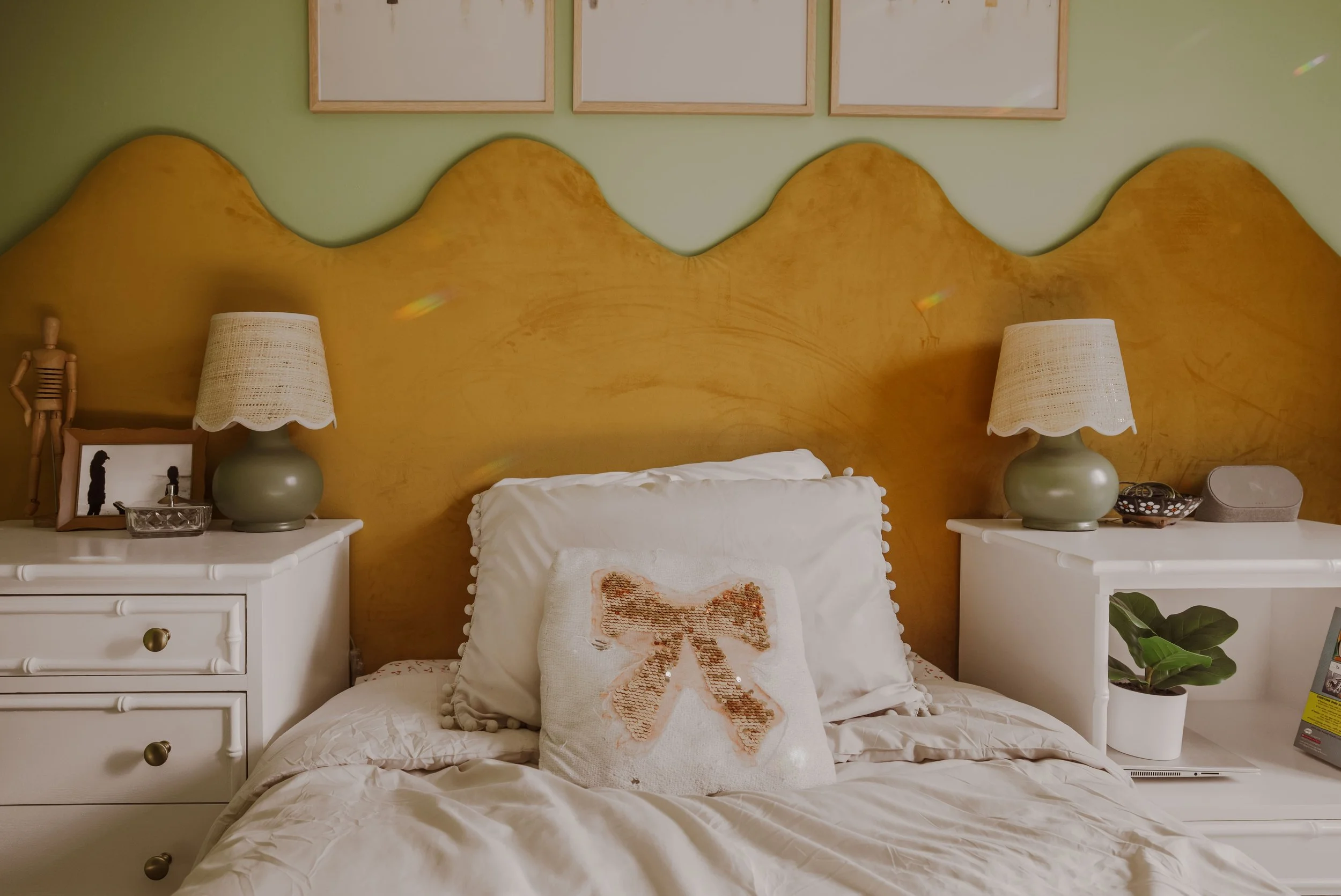 Wavy scalloped mustard velvet headboard with bow pillow