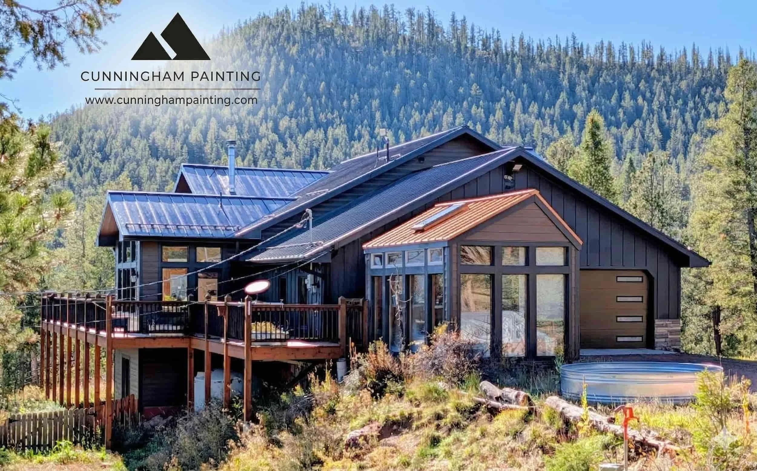 Home in the Colorado mountains with fresh paint. Mountains in the background.