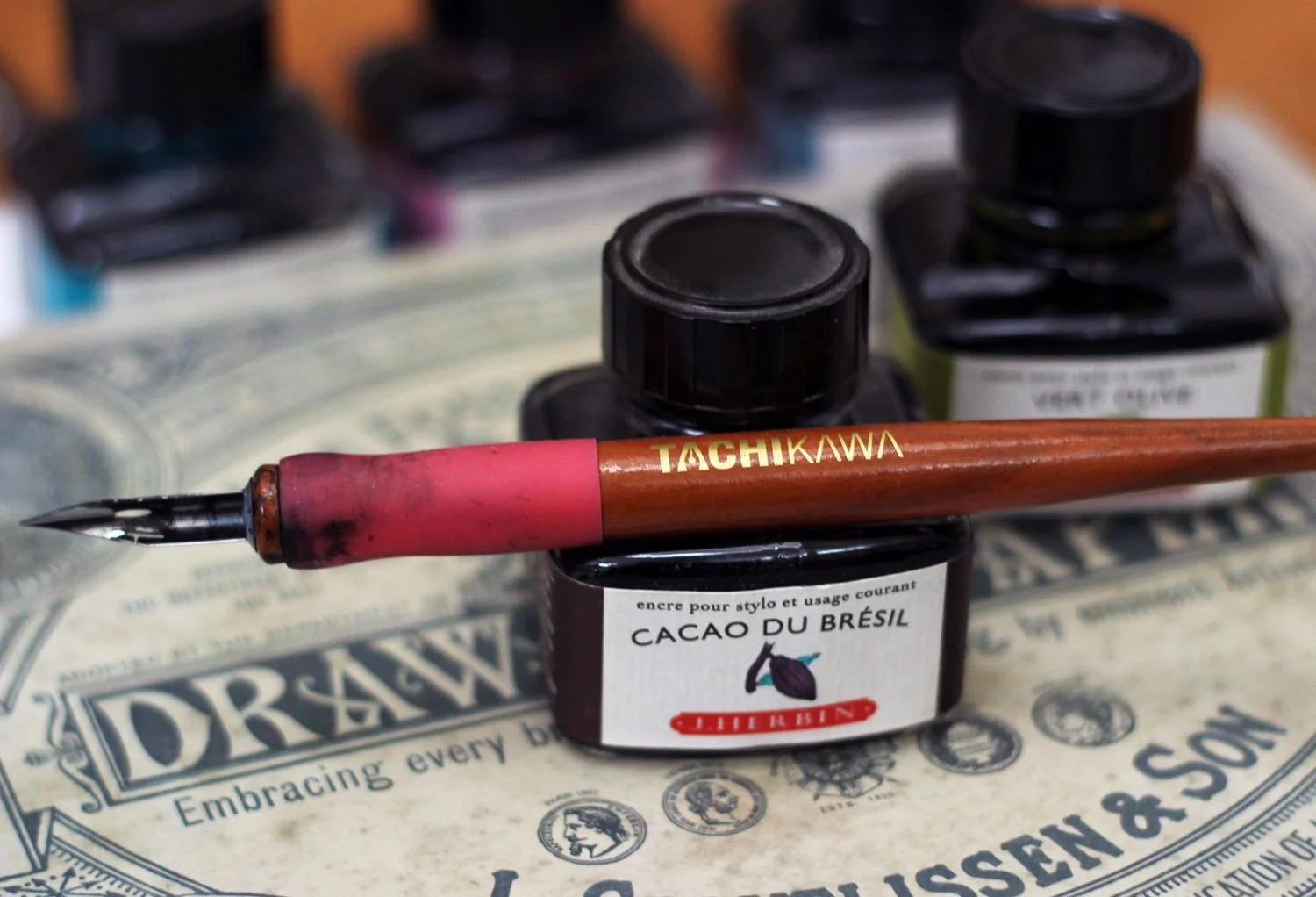 Herbin ink bottle with pen holder.