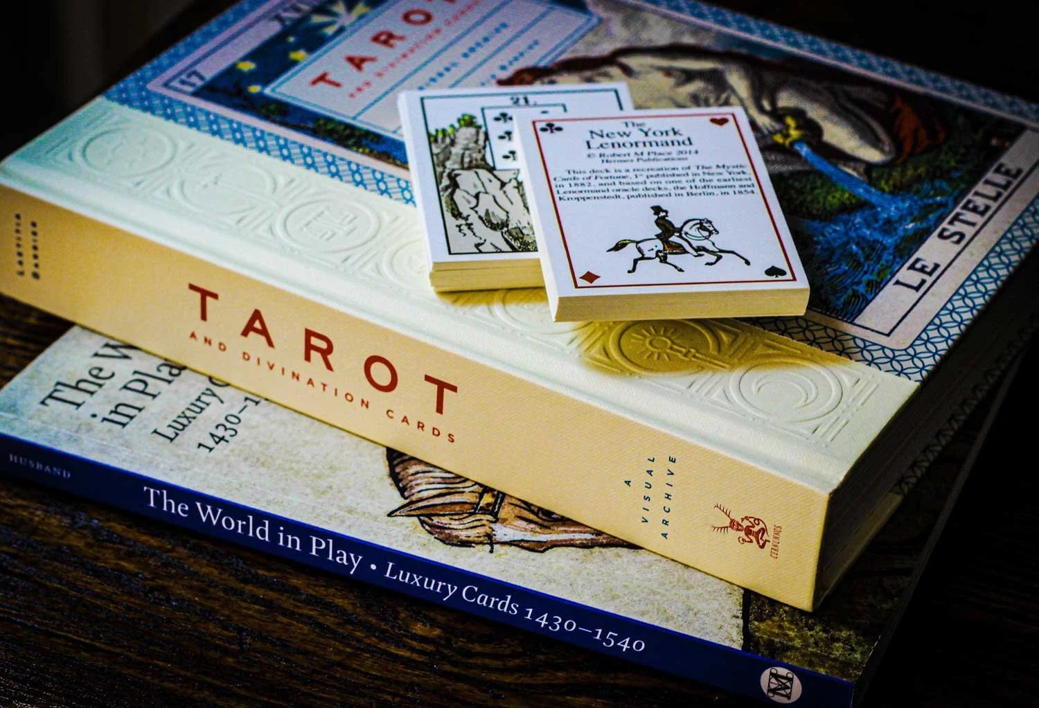 Tarot books and Lenormand deck.