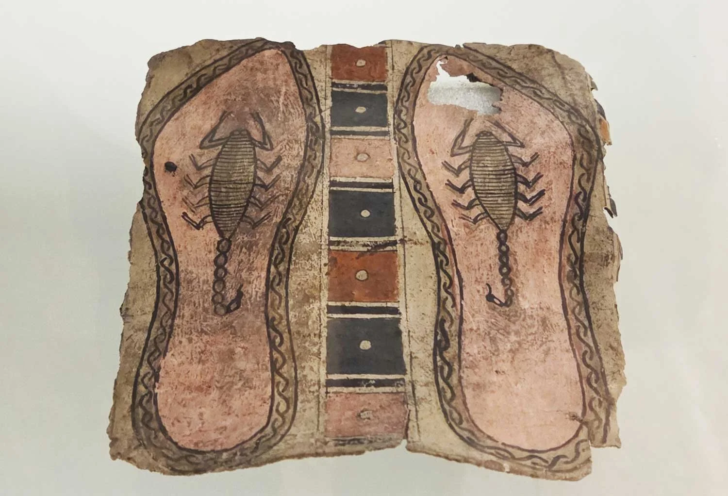 Panel showing reprenting feet with scorpions beneath.