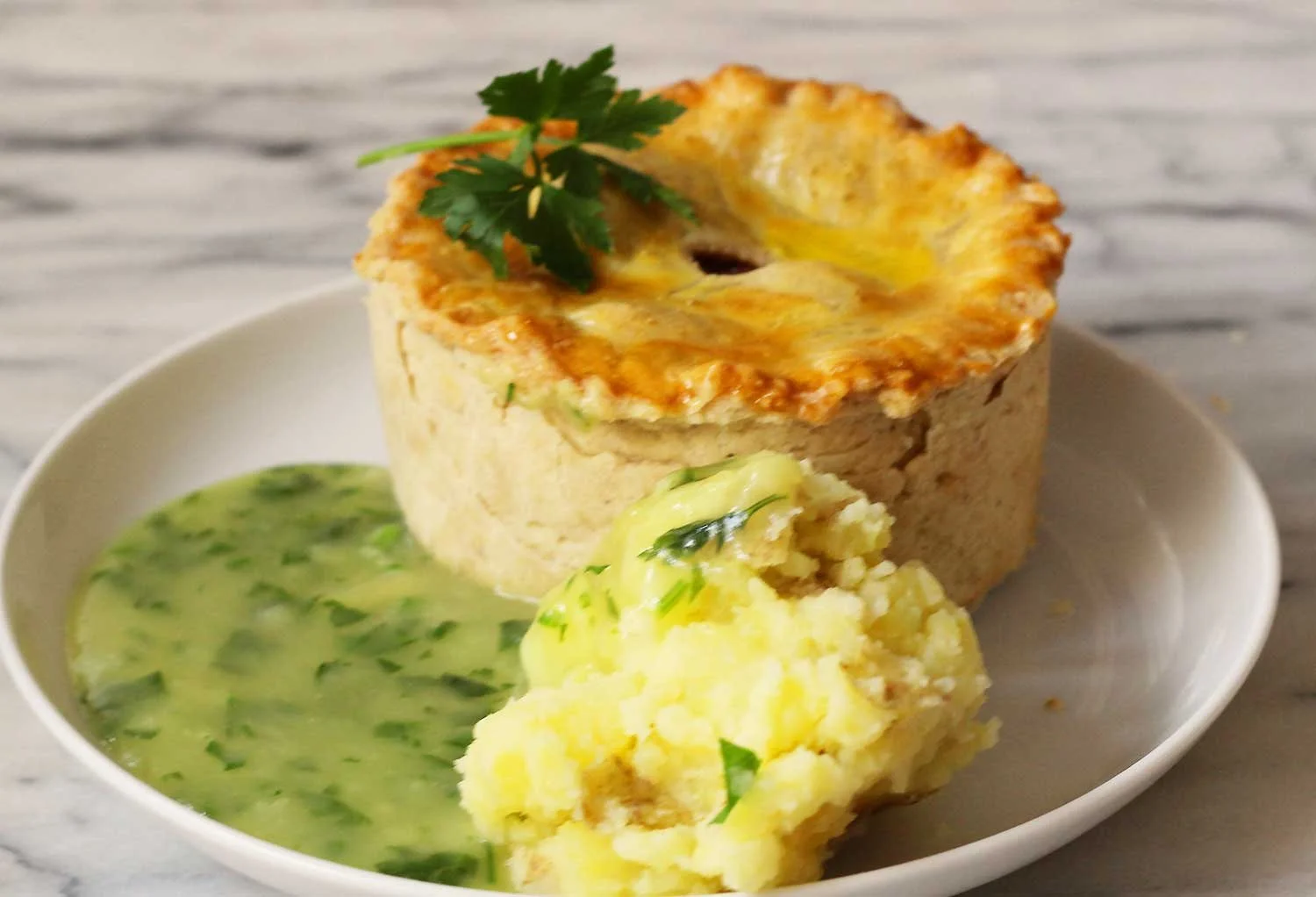 Scotch pie with mashed peas.