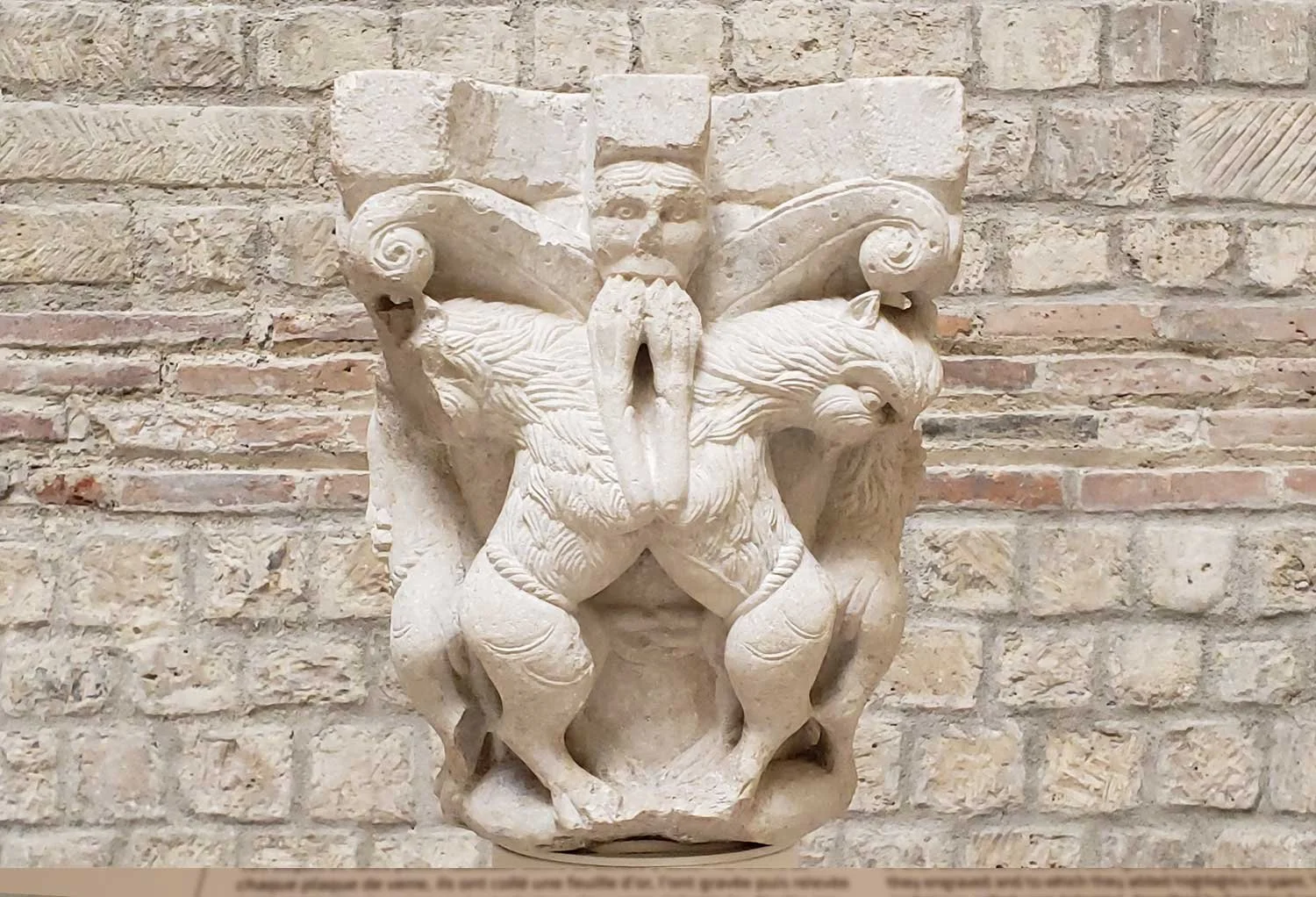 More architectural decoration on column top.