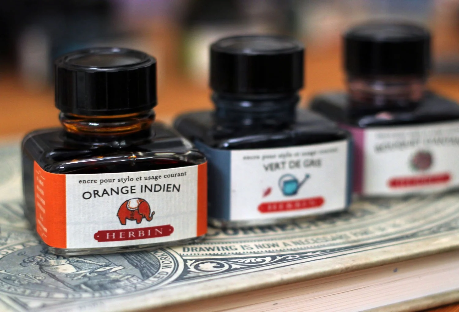 Three Herbin ink bottles.