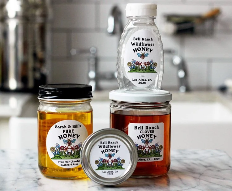 Collection  of jars with personalized honey labels by Nancy Nikko