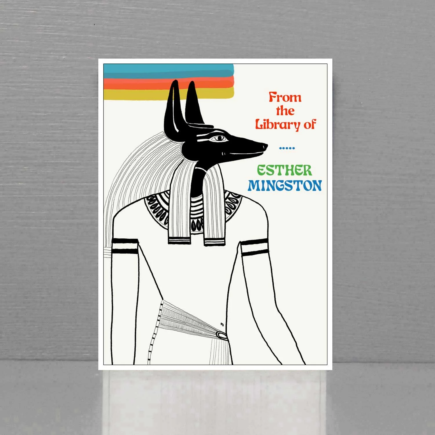 Personalized bookplate with image of the ancient Egyptian God, Anubis in sylized, 70s style.