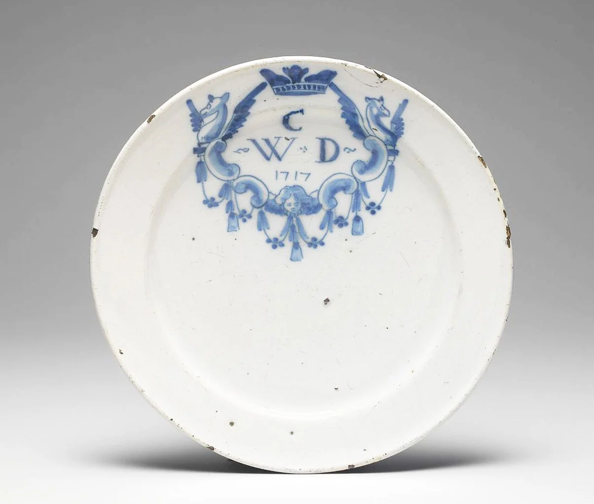 Tin-glazed plate with monogram, 1717.