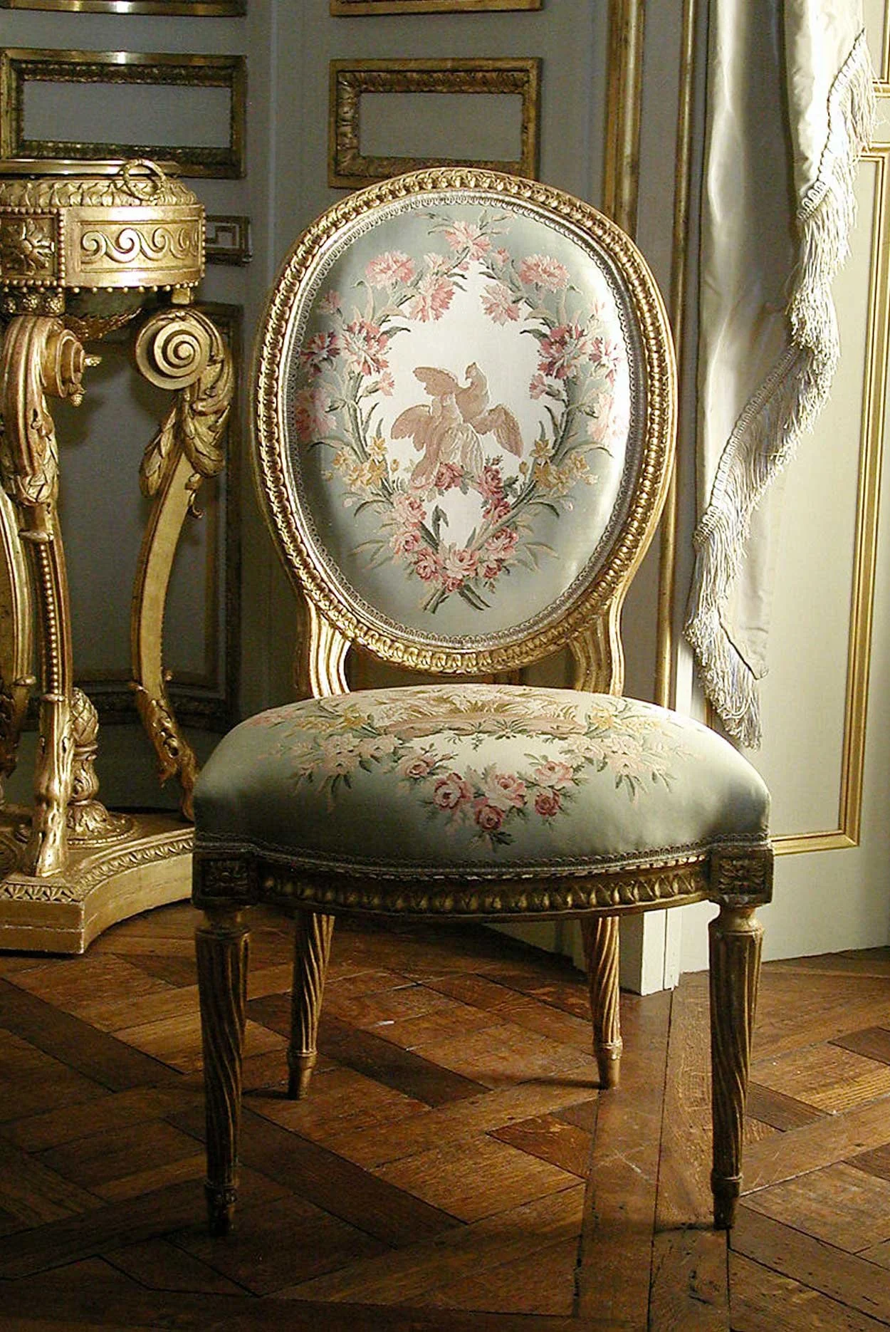 French 'cabriolet' chair with neoclassical design elements in straight legs with twisted fluting, and peg-top feet. The oval back suggests a classical medallion. 1775, Met Museum.