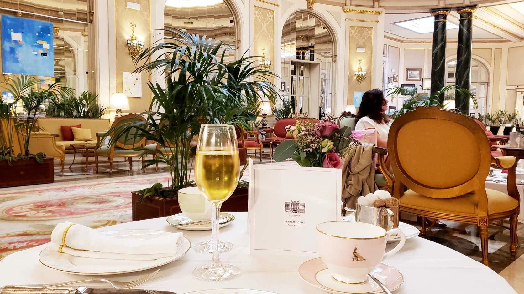 Stylish and classic porcelain china and a glass of Cava.