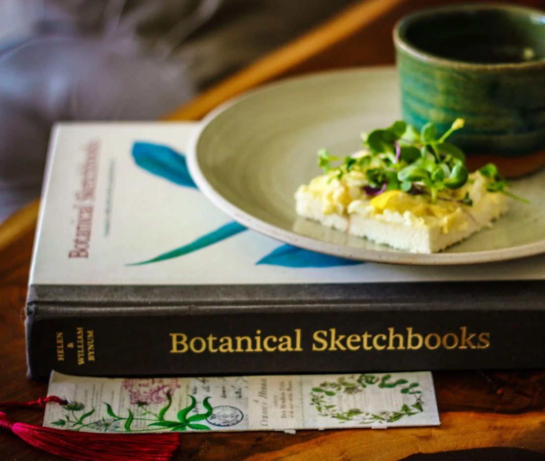Book titled, Botanicl Sketchbooks and teacup.