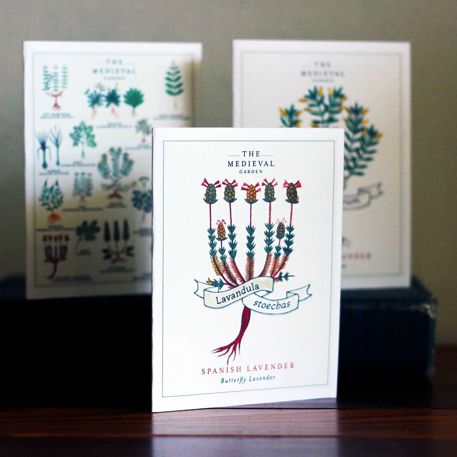 Three cards, each featuring various medieval herbs and antique illustrtations.