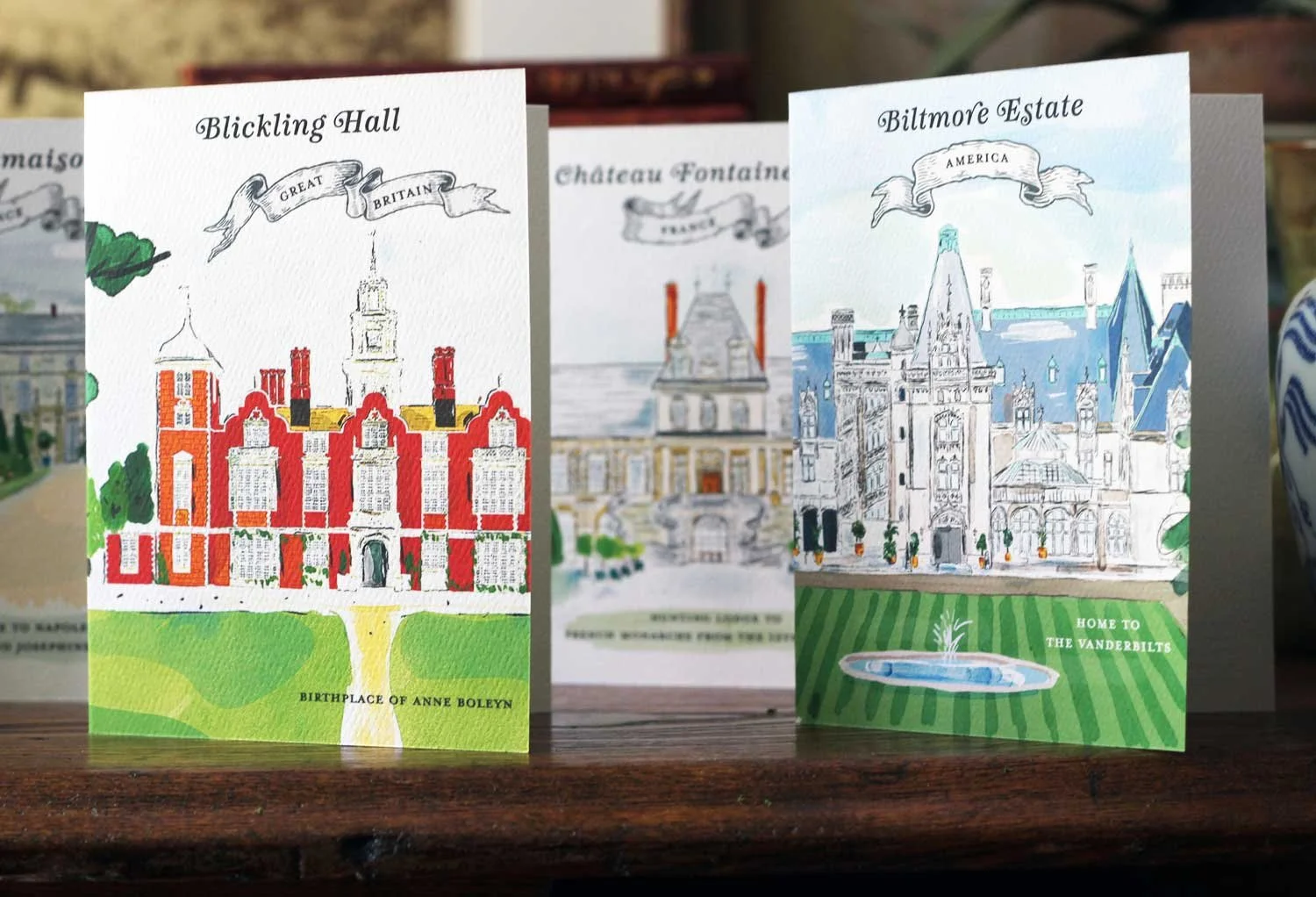 Illustrated cards with stately homes.