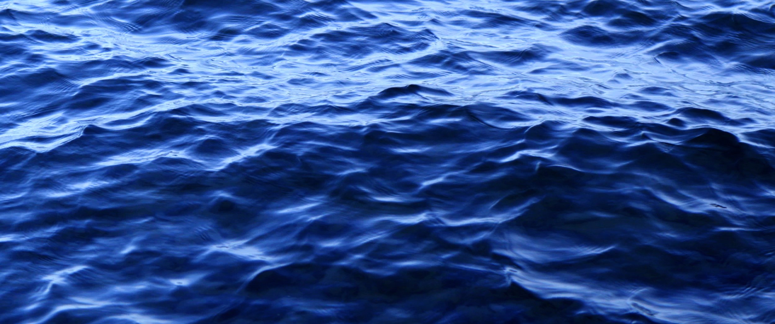 Close-up of serene lake water.