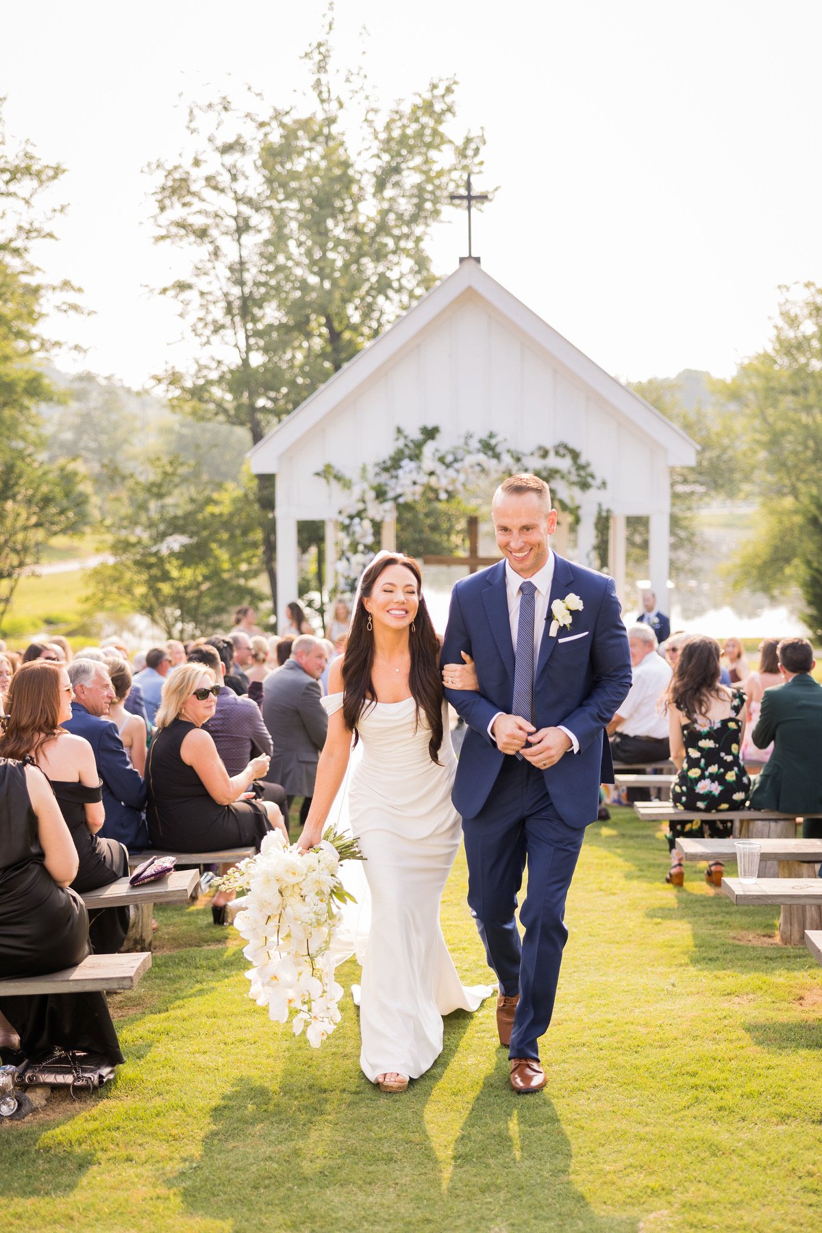 Wedding couple walking down aisle after ceremony