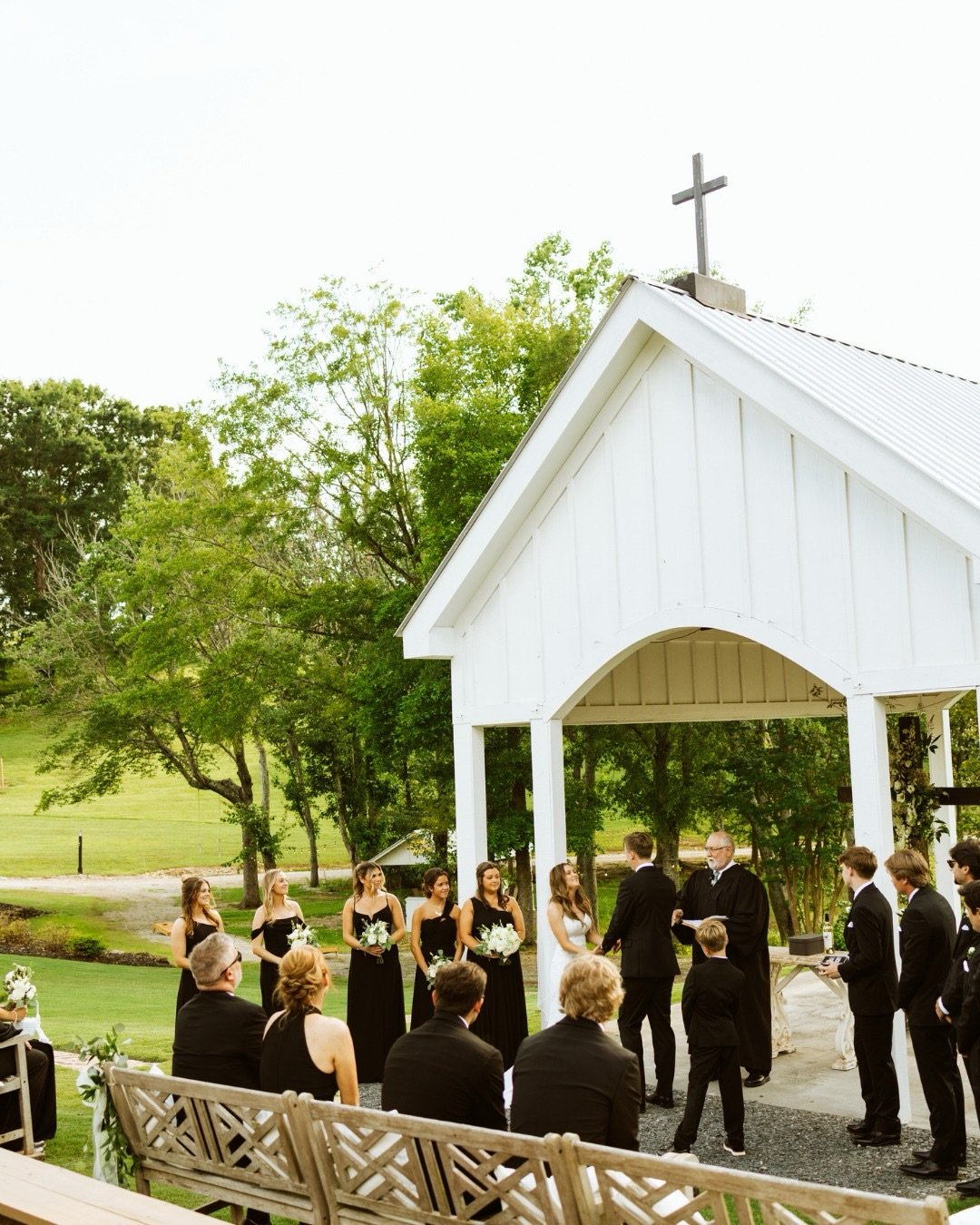 One of the most beautiful spots on the Ranch is the South Wind Ranch Chapel. It sits towering over the lake on a rolling hill with views of the North Carolina mountains. If you opt to not use the beautiful cross, your florist can dream up your own un