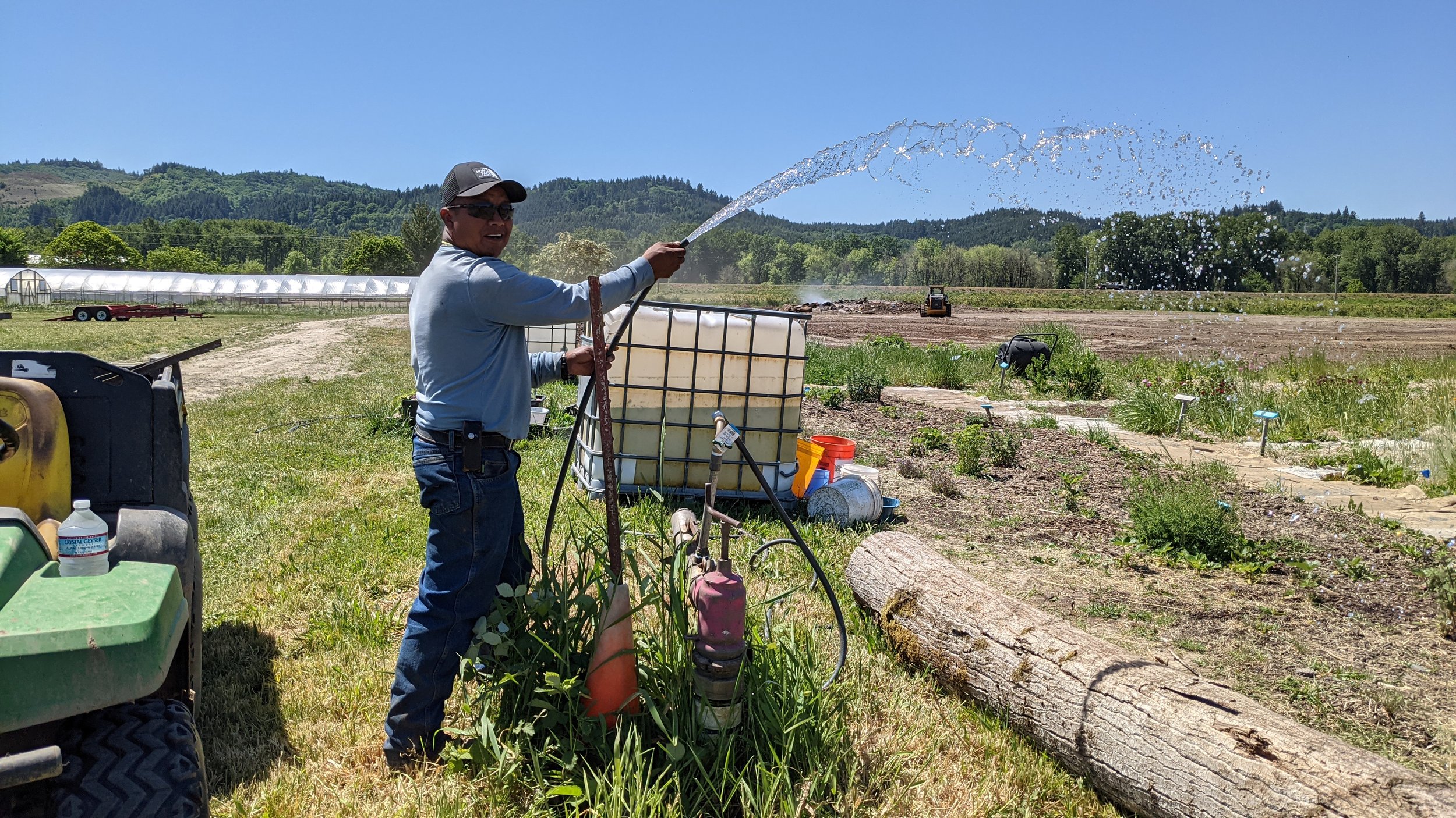  Luis setting up a water system for the Sauvie Island Center and their campers to use to water their Lunch Grow Garden. 