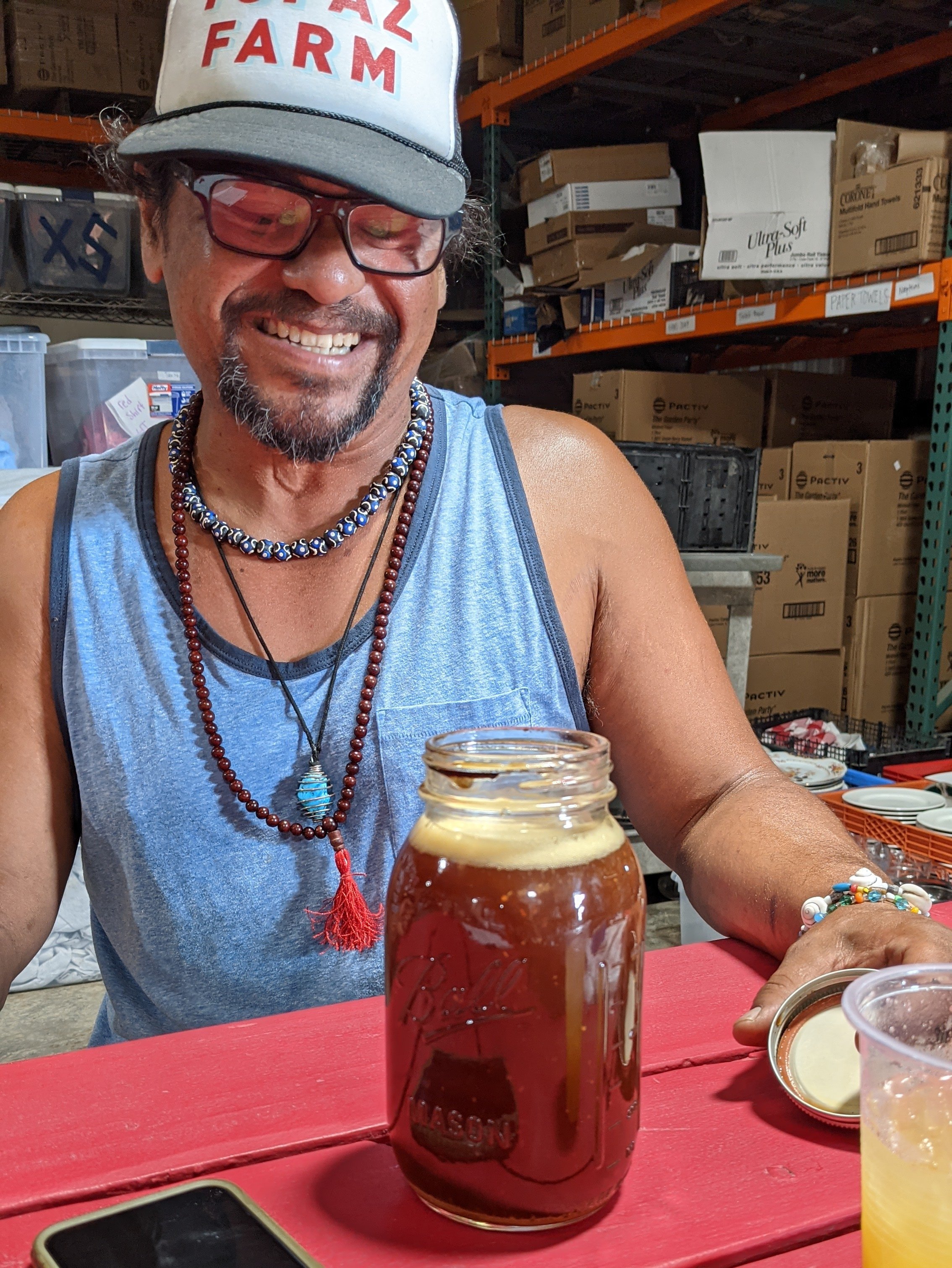  Our soil guru, Cuauhtemoc Villa, shows off the healthy microbes aka compost tea we’ve been making to add to the water and the soil.  