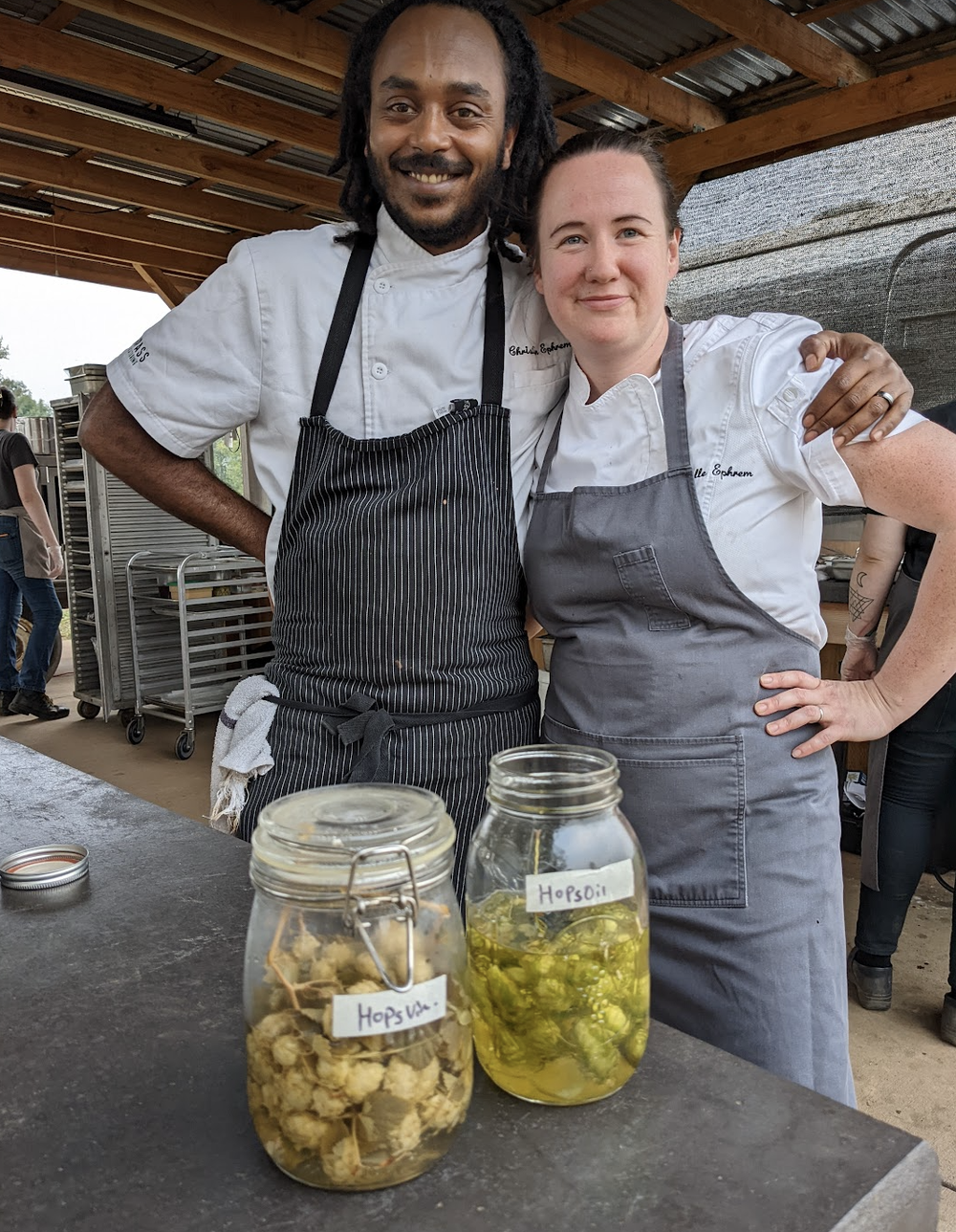 Chefs Christian and Janelle preparing before the first Brewer's Series Farm to Plate dinner featuring Fort George Brewery.