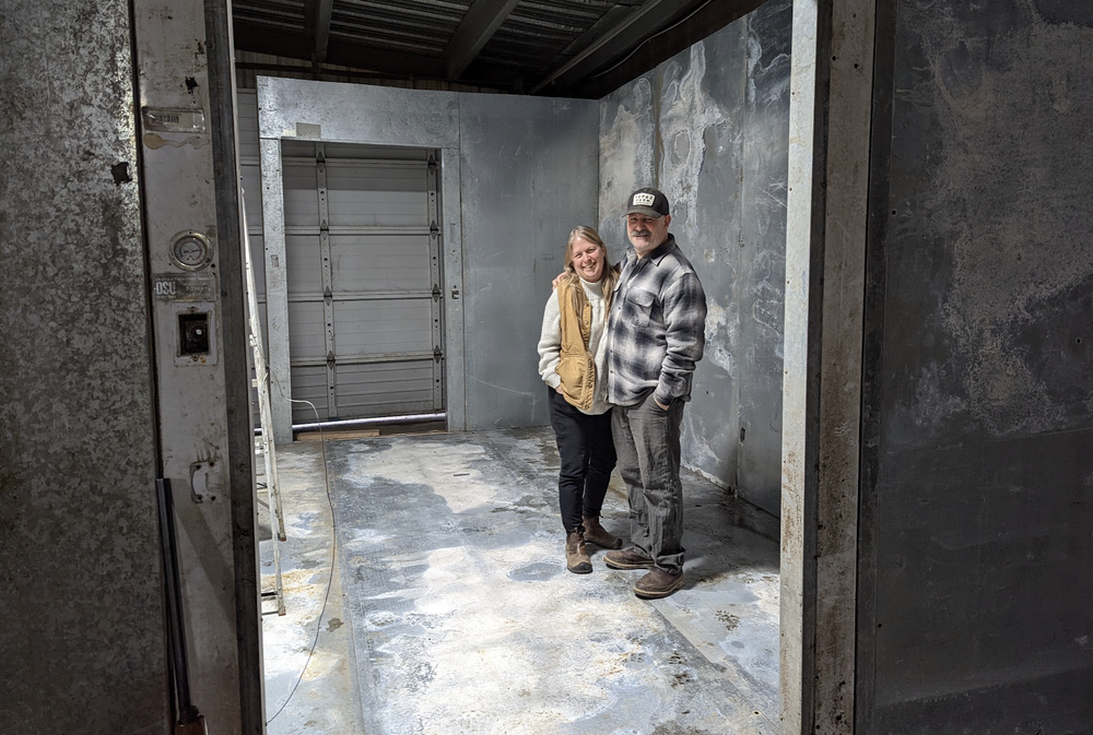 Kat and Jim in the new (to us) walk-in freezer as it was being constructed. This was used to store the 12 cows we harvested.