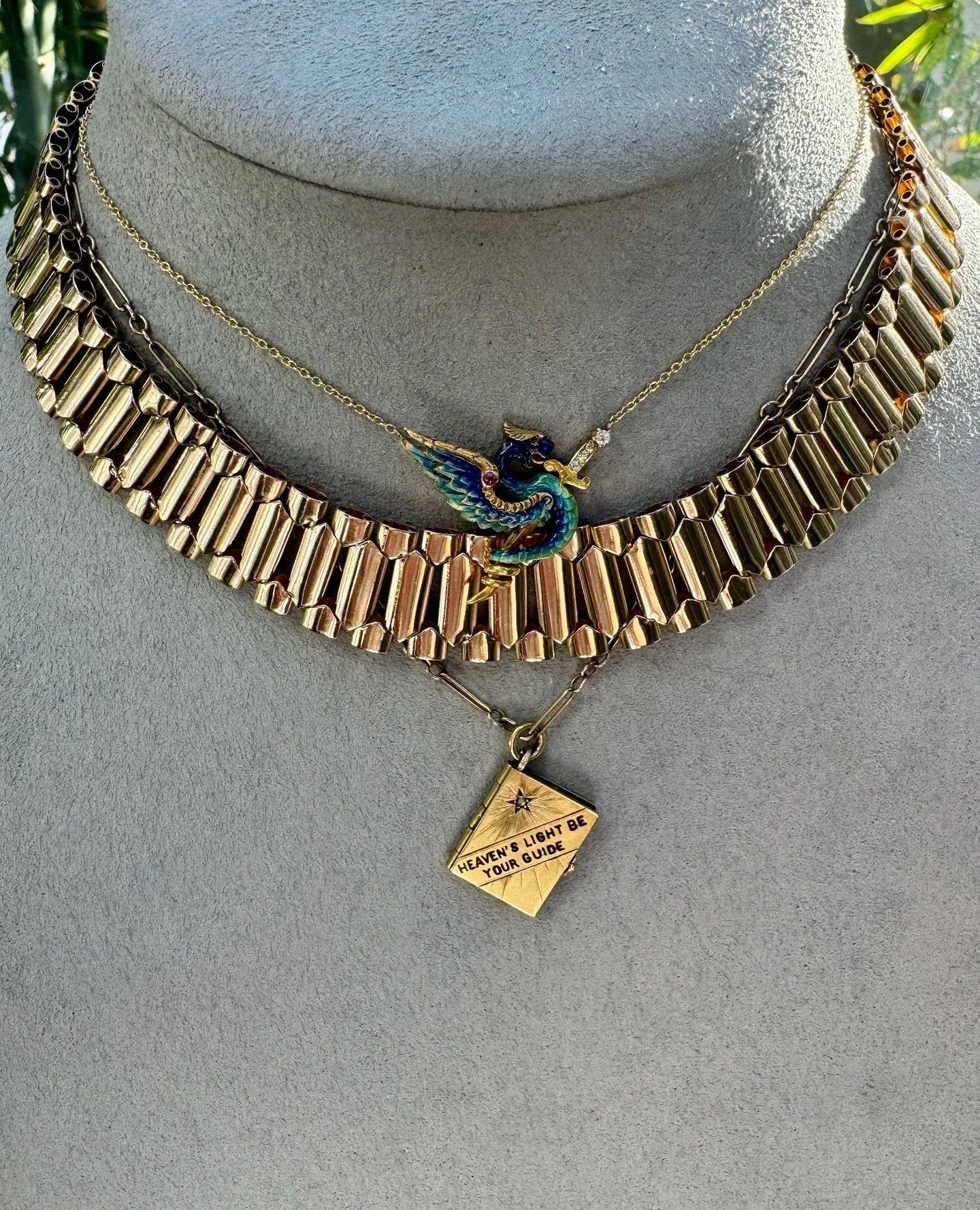 New In: The richness of this collection features enamel work that is so pristine in detail, coupled with a rare collectors locket from the Coronation of King Edward in 1902. Cindy paired these with our Extraordinary Book Collar Necklace to transform 