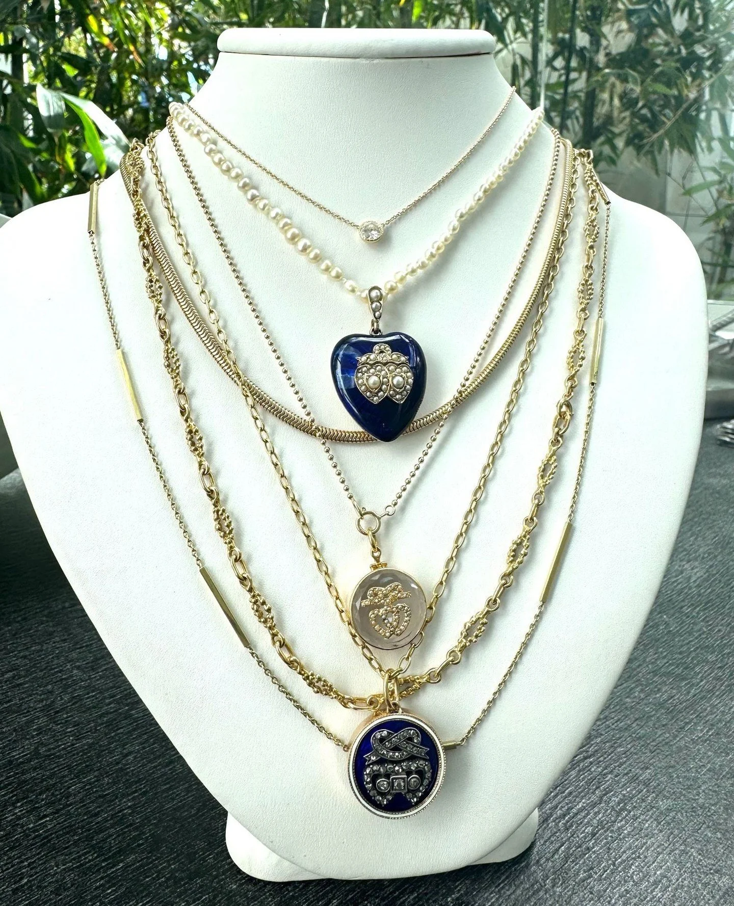 A little romance, a little history, and a lot of personality. Pearls, gold, deep blue enamel, sentimental lockets, and just enough sparkle to make the whole stack feel like it has lived a few very interesting lives. It&rsquo;s polished, but not predi