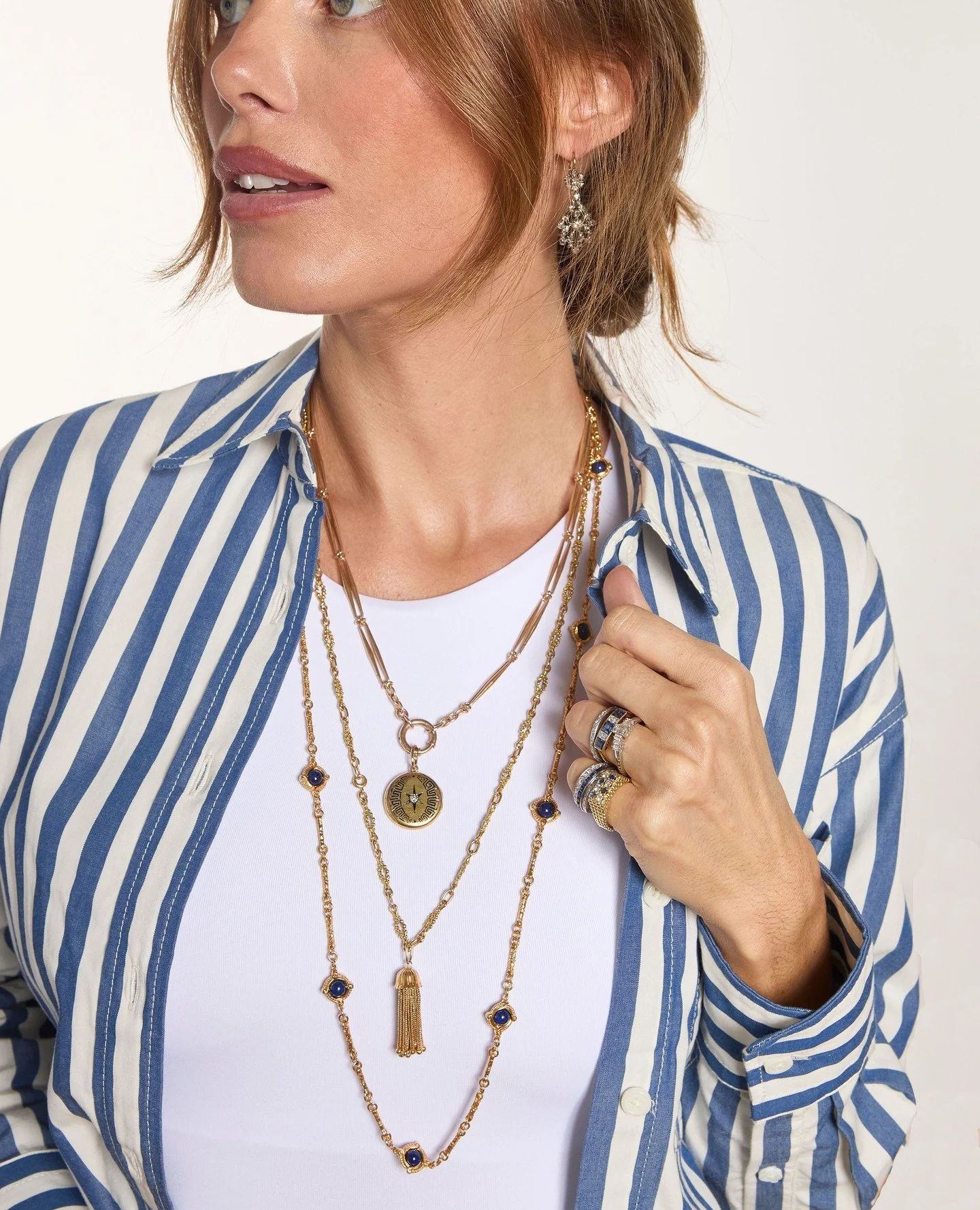 Layers of Luxury: An odd number of chains tends to look best because the eye naturally reads it as more balanced, dimensional, and effortless. When styling fine jewelry, odd numbers create visual movement, a more organic silhouette, and less symmetry