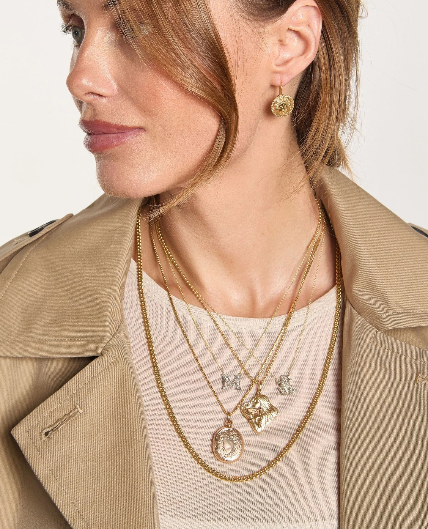Layered gold pieces that carry the weight of time and the lightness of elegance.