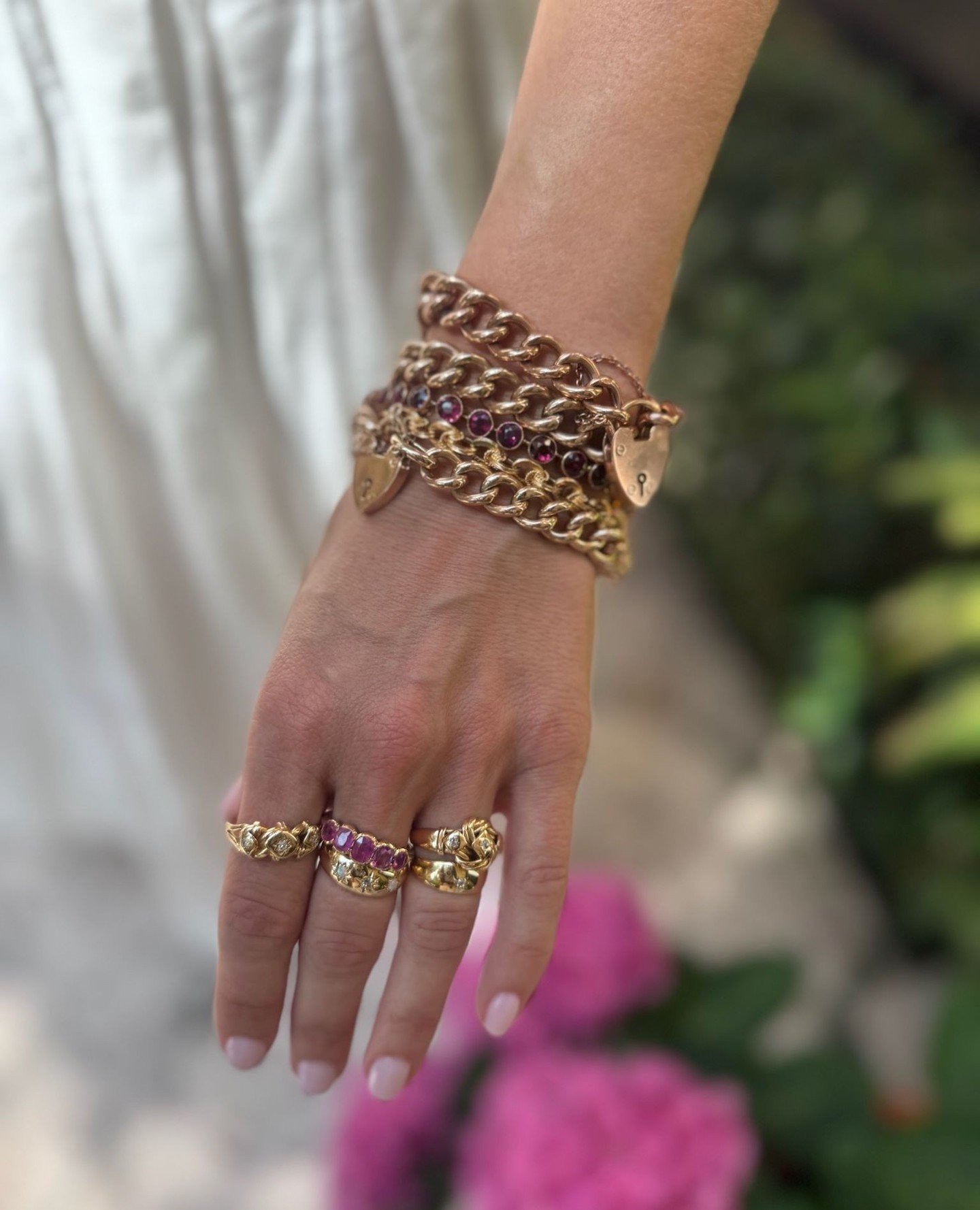 Heavy on the gold, heavier on the romance. Antique heart padlocks were made to be layered.