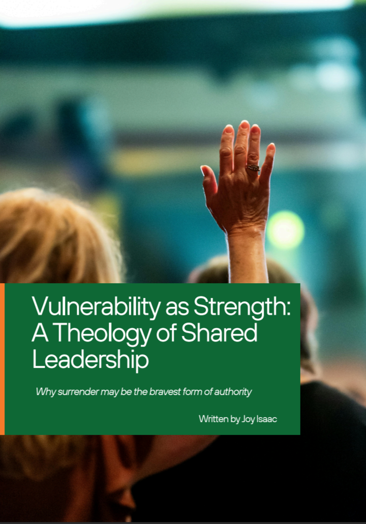 A hand with an open palm raised in a crowd at a conference or seminar, with a green overlay containing the title of a book or article about leadership.